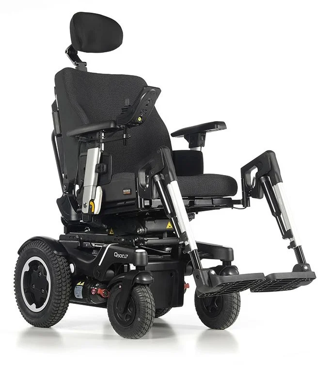 Electric wheelchair with adjustable seat, footrests, and headrest on a white background.