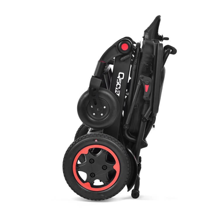 Folded electric wheelchair with black and red wheels
