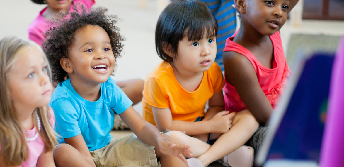 young children seated on the floor