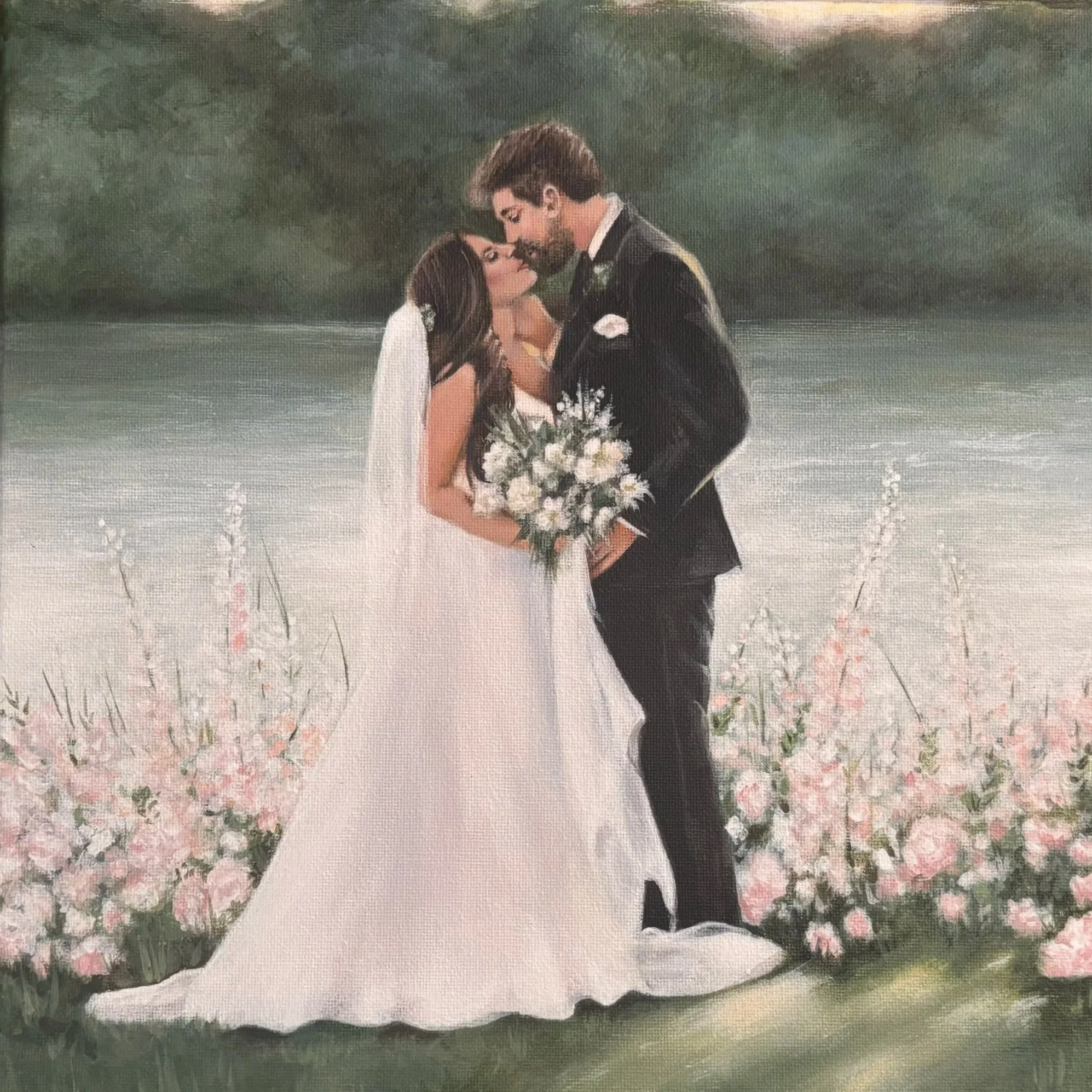 A bride and groom stand close together outdoors, with the bride holding a bouquet of white flowers, near cherry blossom trees blooming with pink flowers.