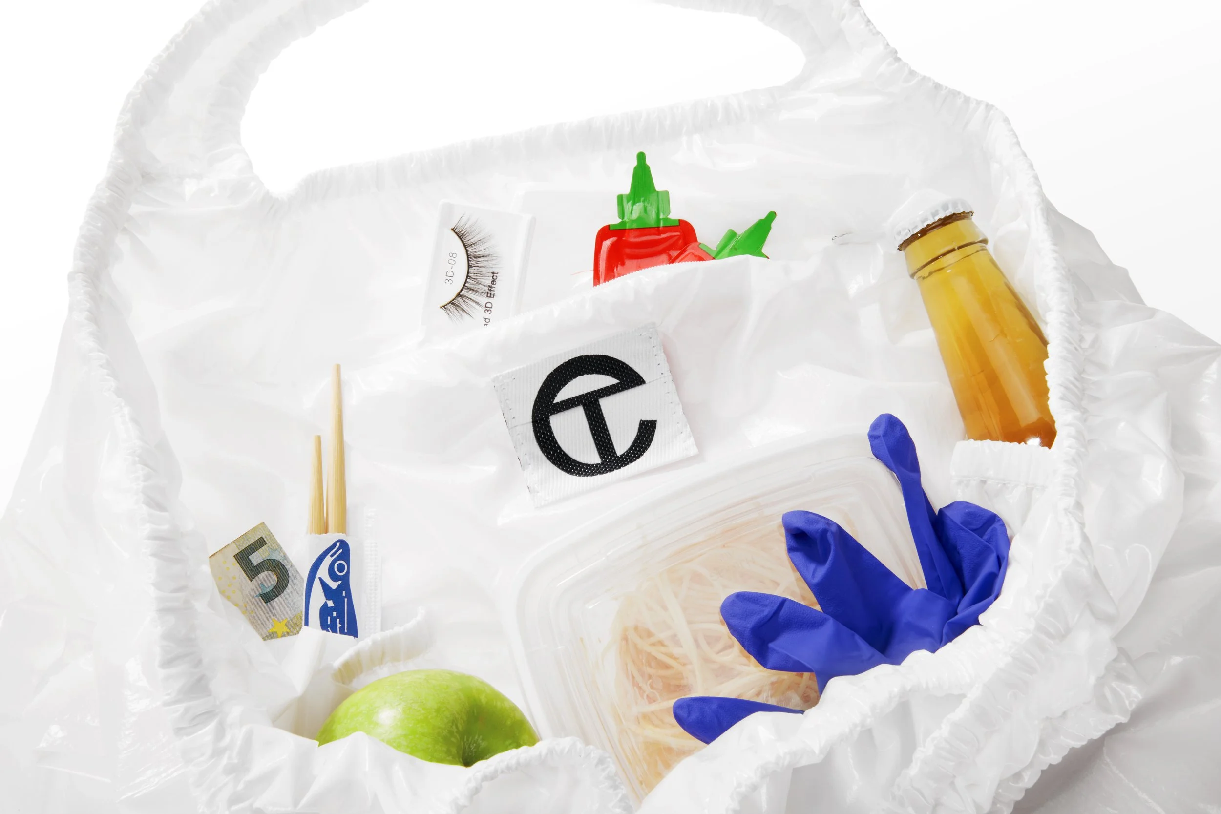 TELFAR-MEDIUM-SMILEY-FACE-PLASTIC-BAG-WHITE-INTERIOR.jpg