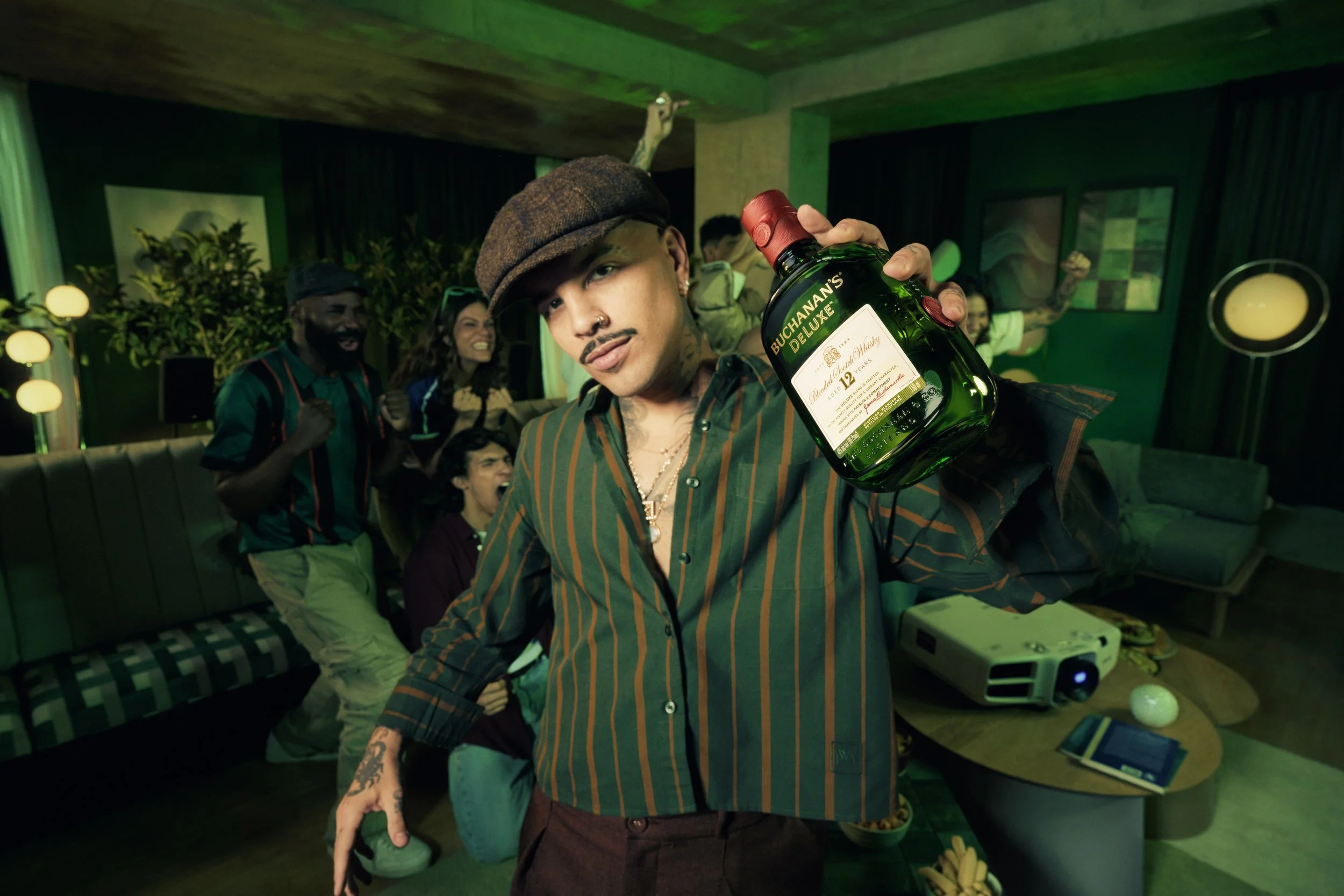 Rauw Alejandro raises Buchanan's Blended Scotch Whisky DeLuxe for  FIFA World Cup 26™ Campaign.jpg