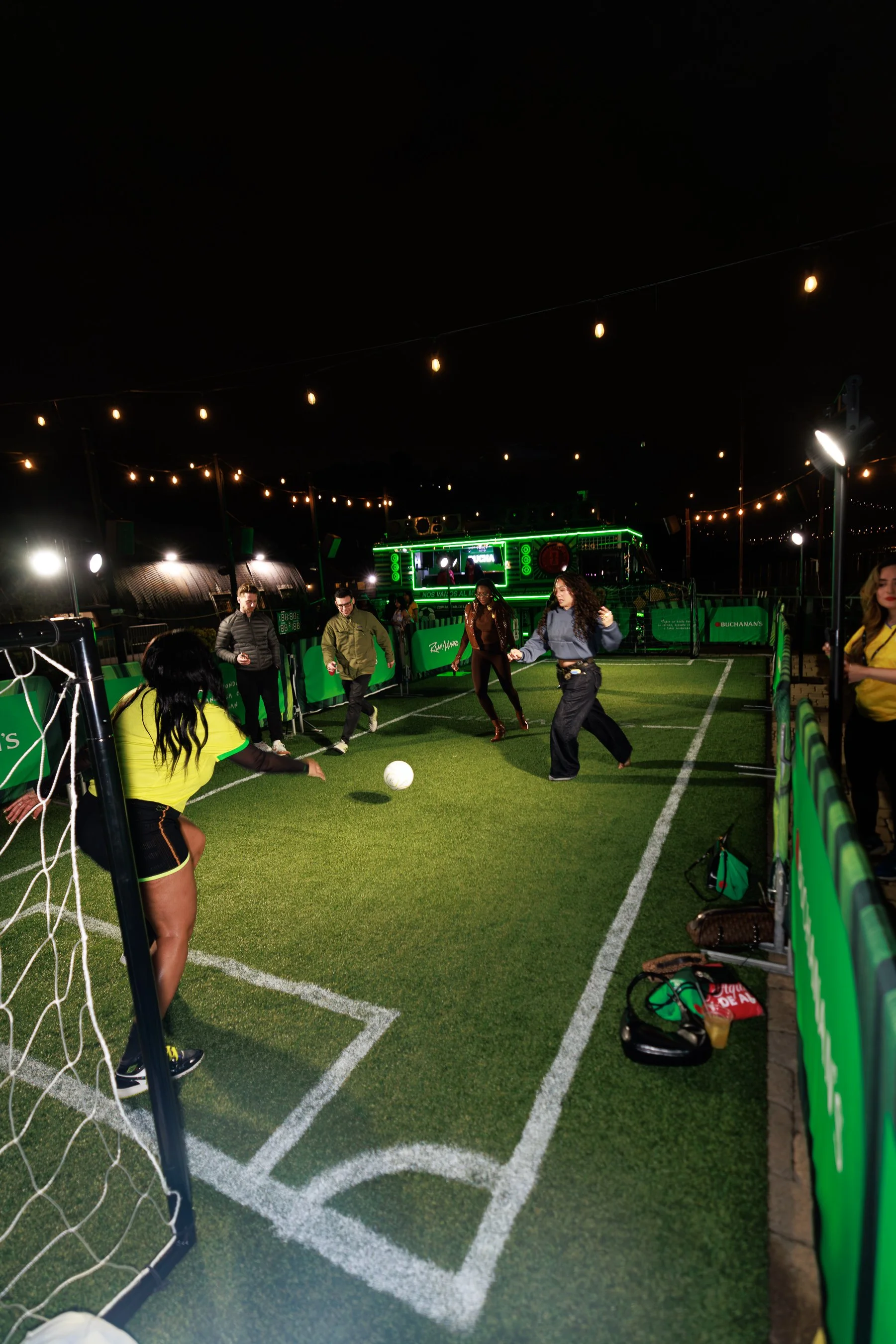 Guests tap into the energy of Rauw Alejandro's 'Dando Vueltas' with a spirited game of fútbol with Buchanan's Whisky in NYC. Photo credit: Finalis Valdez.jpg