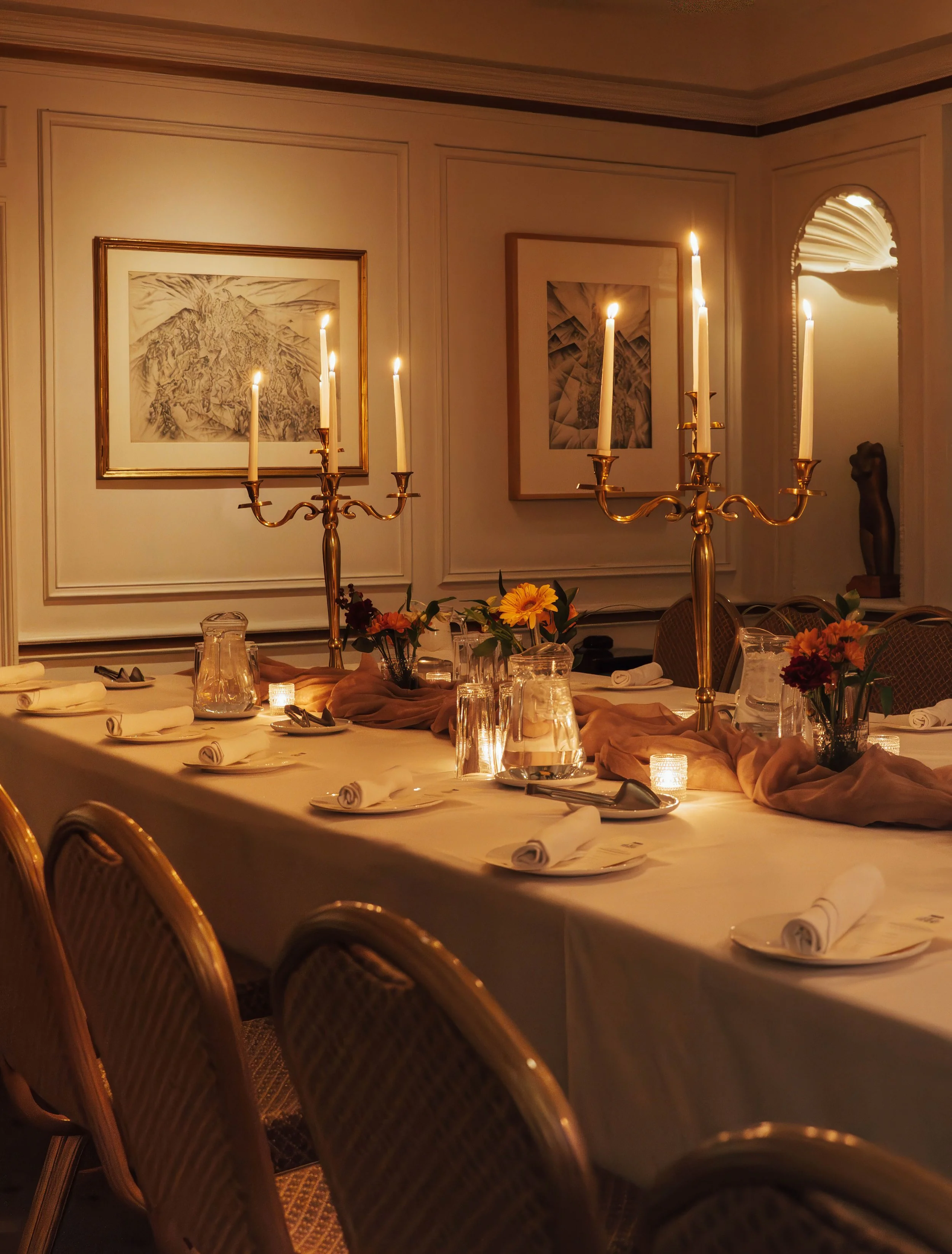 Elegant event table setup with candles and floral decor during private celebration, photographed by Toronto and Ontario event photographer Lara Grace Creative Studio