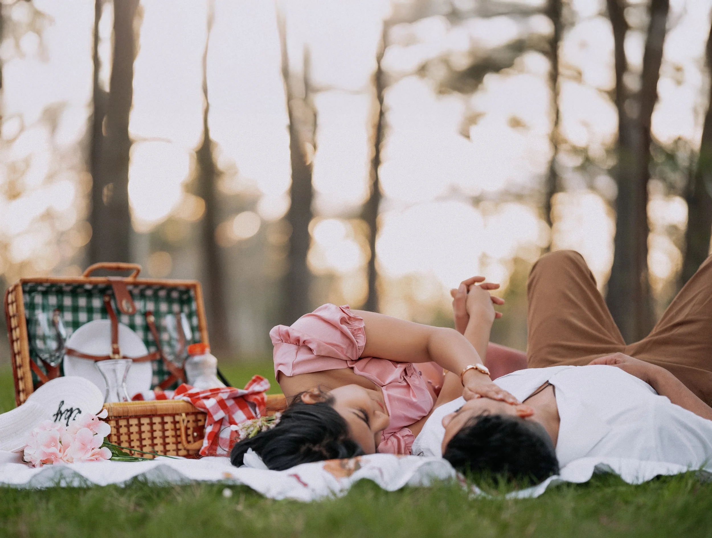 Niagara spring engagement session with couple relaxing on picnic setup, outdoor golden hour couple photography in Ontario