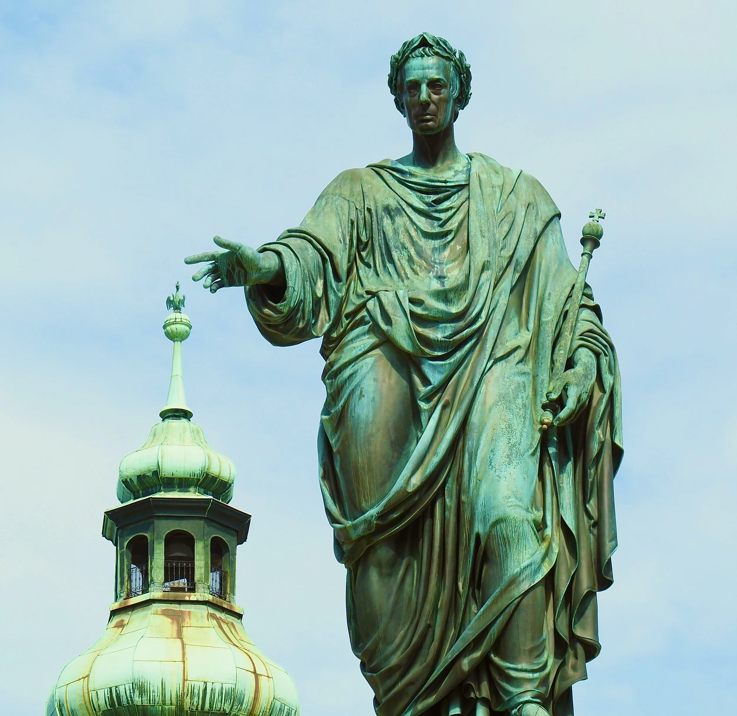 Close-up of the Statue of Freedom, a bronze sculpture on top of the Capitol building, featuring a woman in classical dress with a helmet and holding a staff.