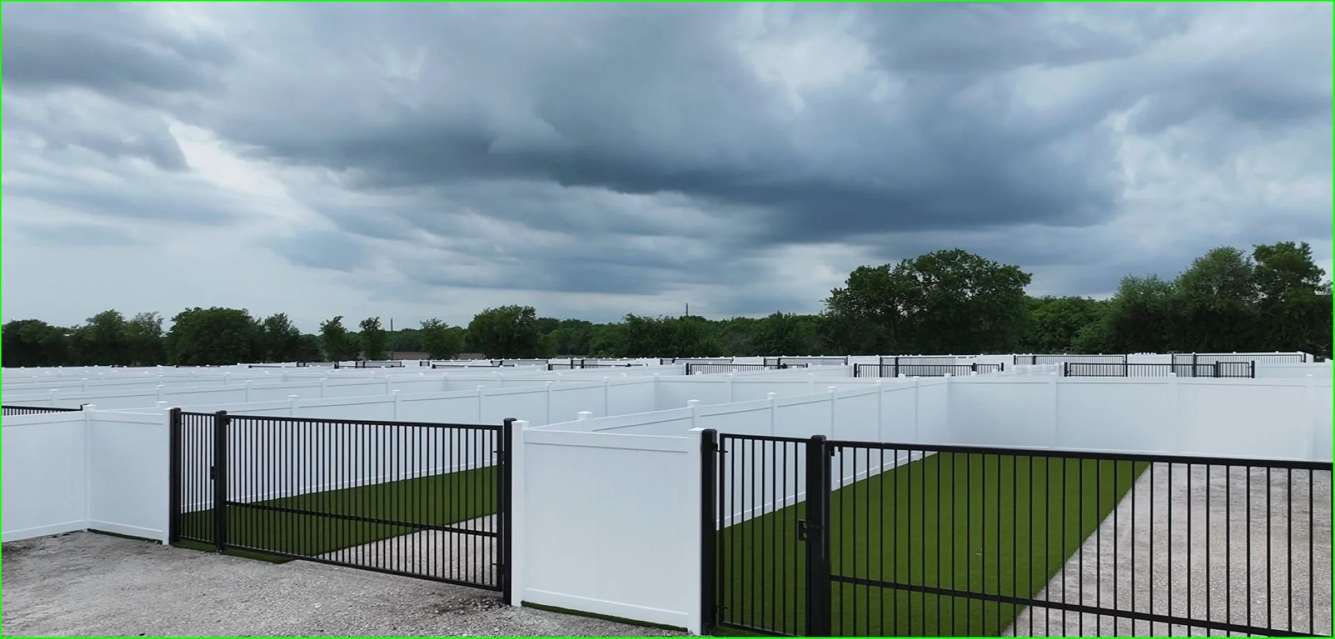 Private RV lots with gates and turf yards under Texas clouds.