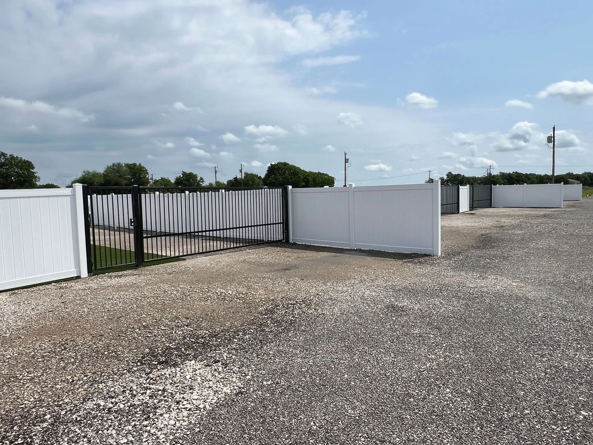 Gated entrance and gravel drive at NorthStar RV Park.
