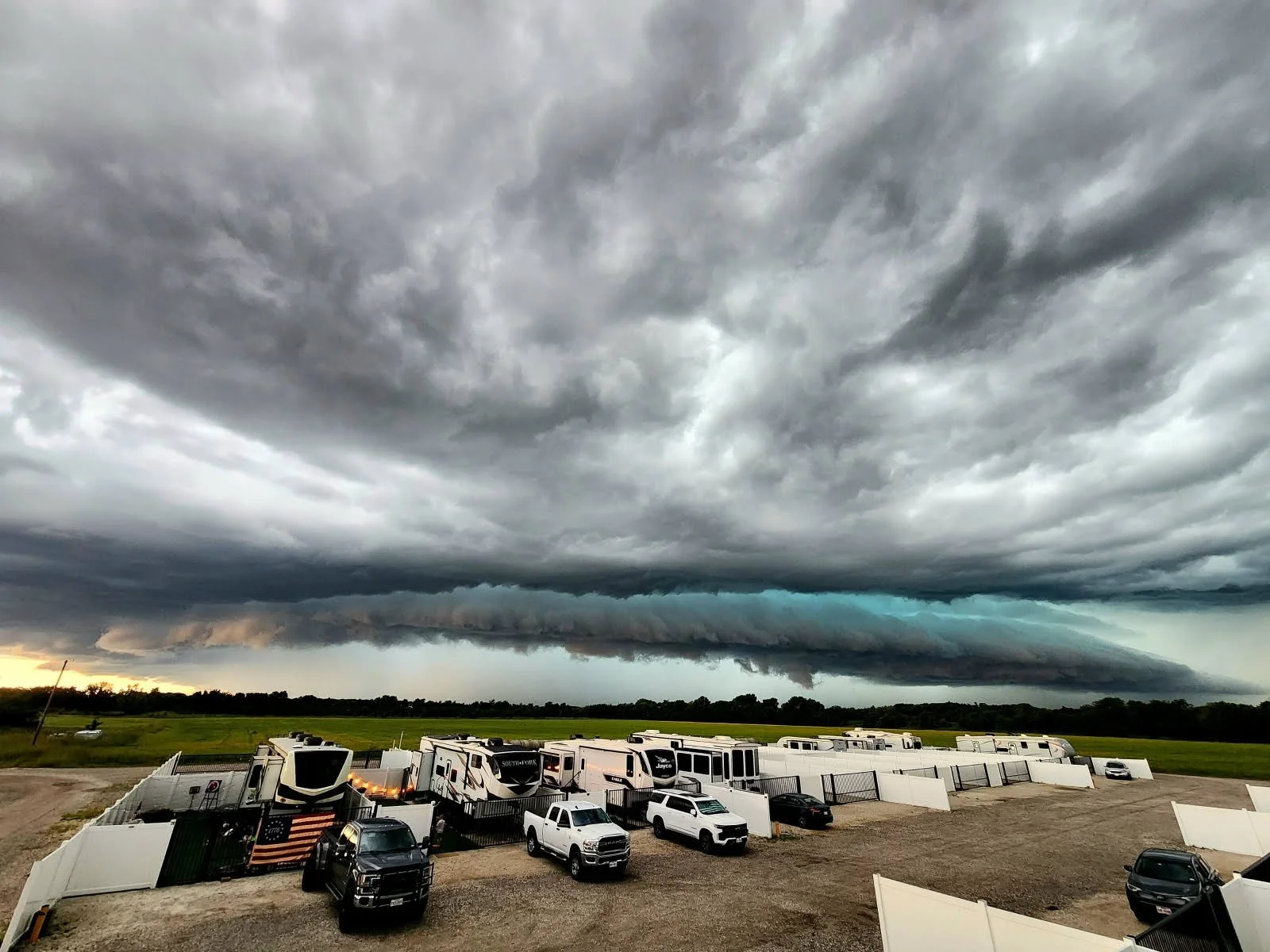 Cloud formations above RV sites and trucks at NorthStar RV Park.