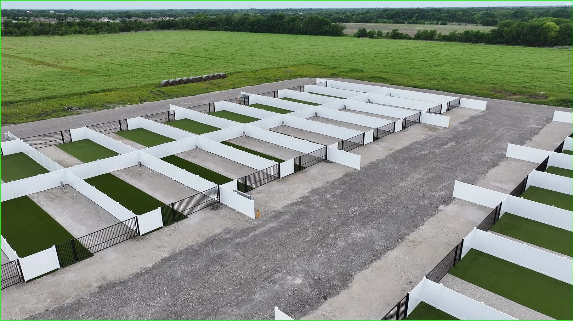 Aerial view of fenced RV sites with gravel drives and turf yards at NorthStar RV Park.