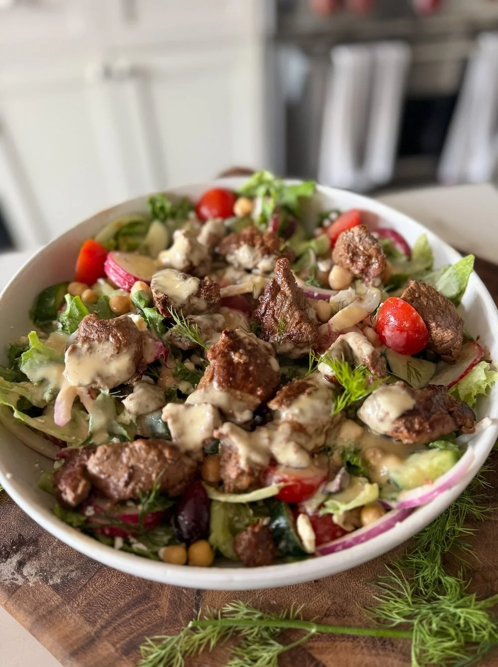 Omaha steak salad with hummus dressing