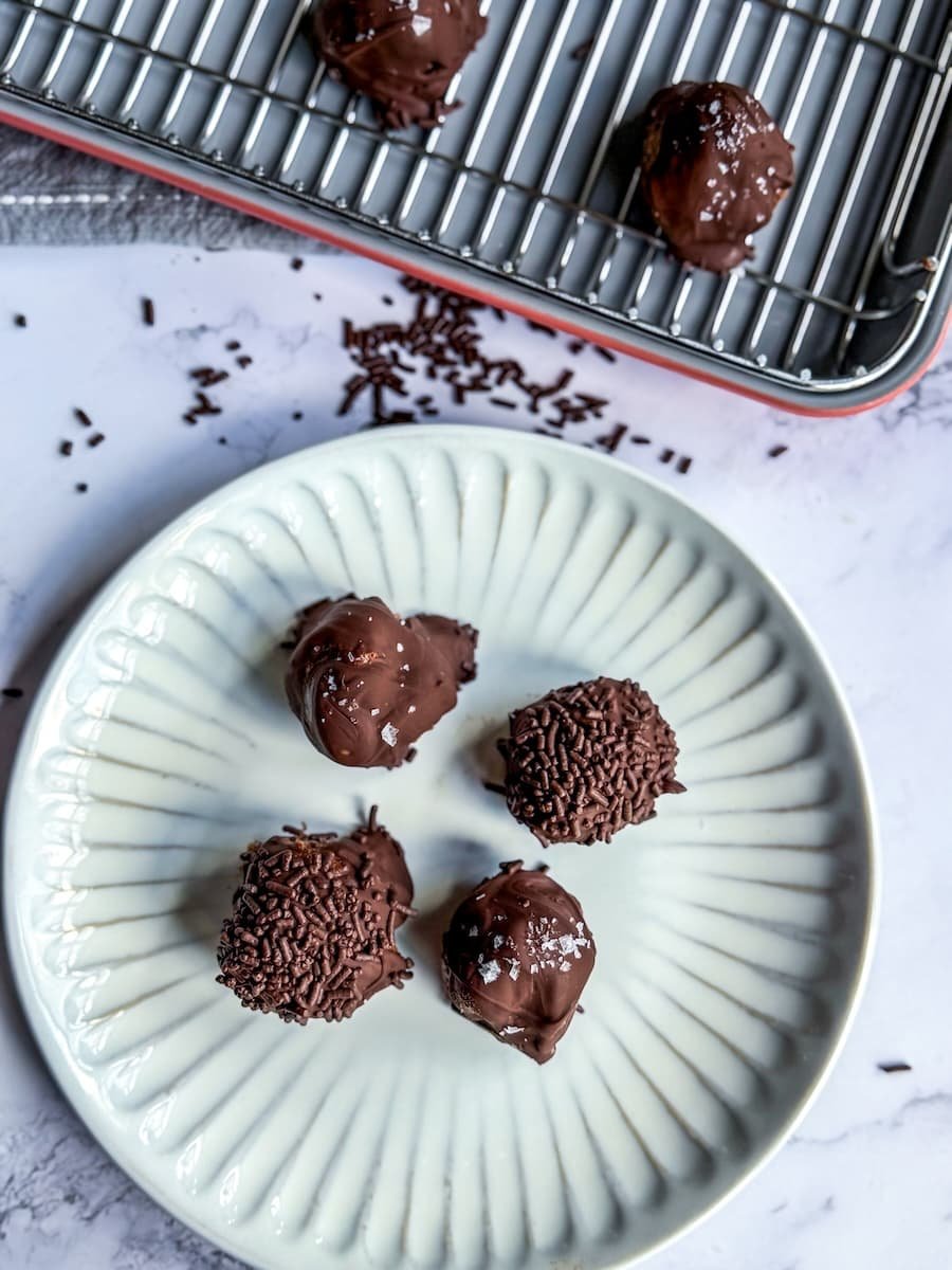 protein dessert / overhead photo of 4 high-protein cottage cheese truffles on a plate