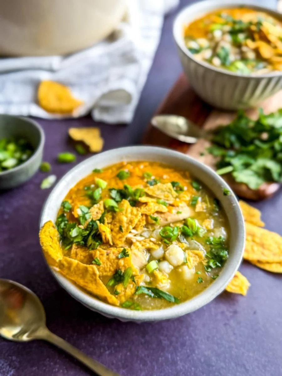 close-up photo of a bowl of chicken pozole verde - what is pozole