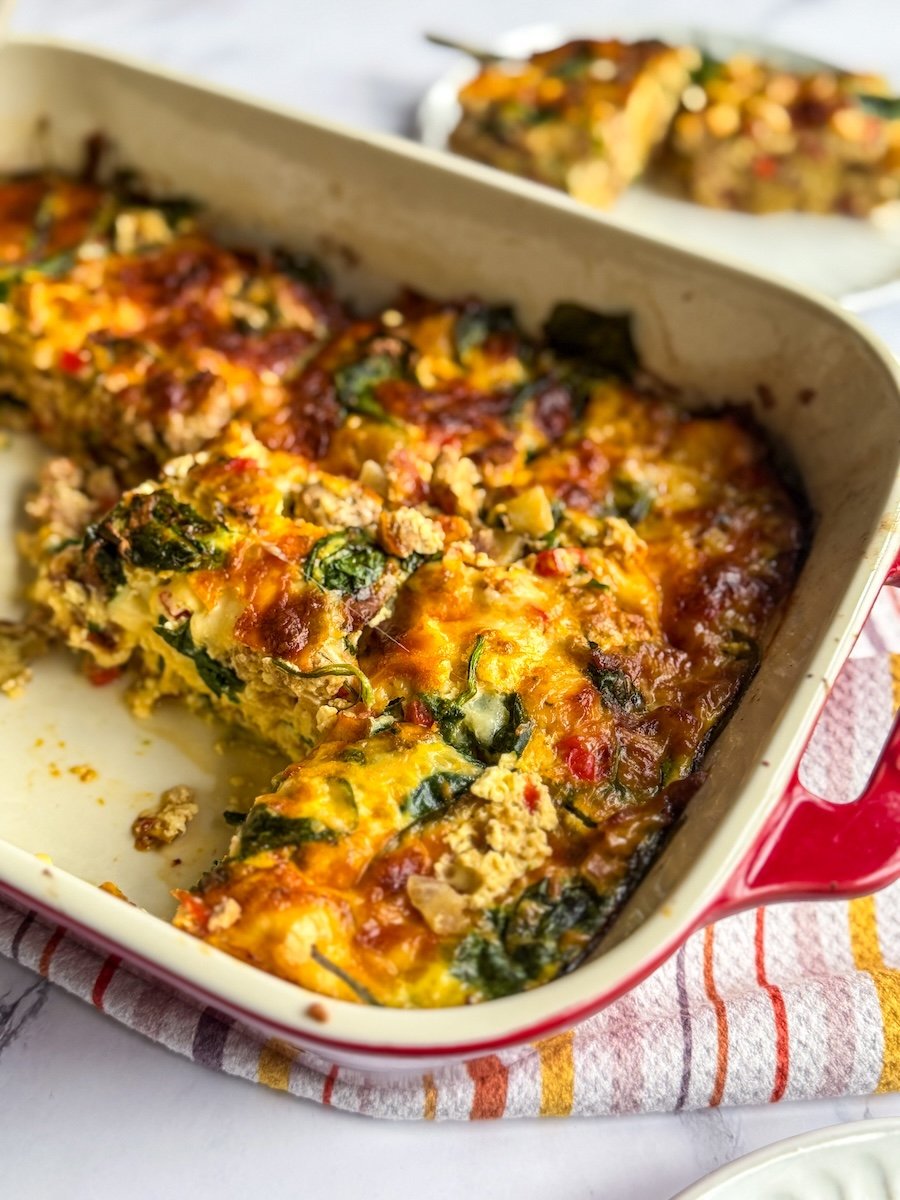 gluten free breakfast casserole - baking dish with casserole in it and a few slices missing