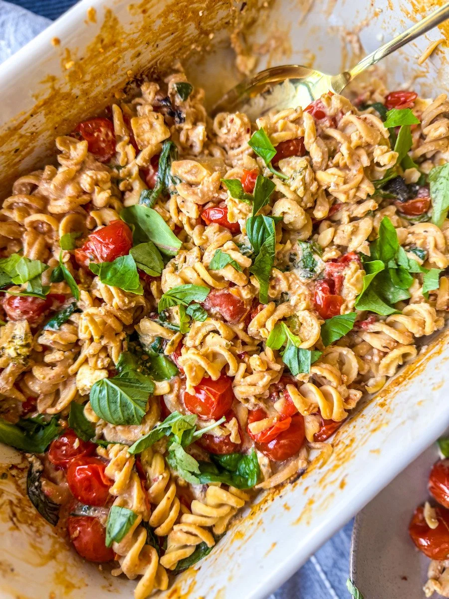 close-up of baked tomato feta pasta in the baking dish