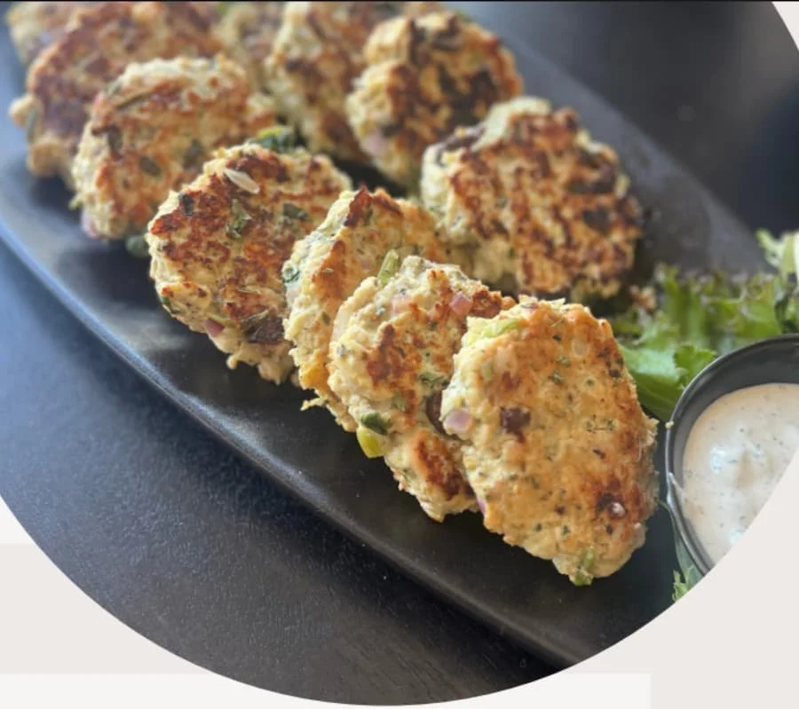 ground chicken recipes - Mediterranean chicken patties on a platter with dipping sauce