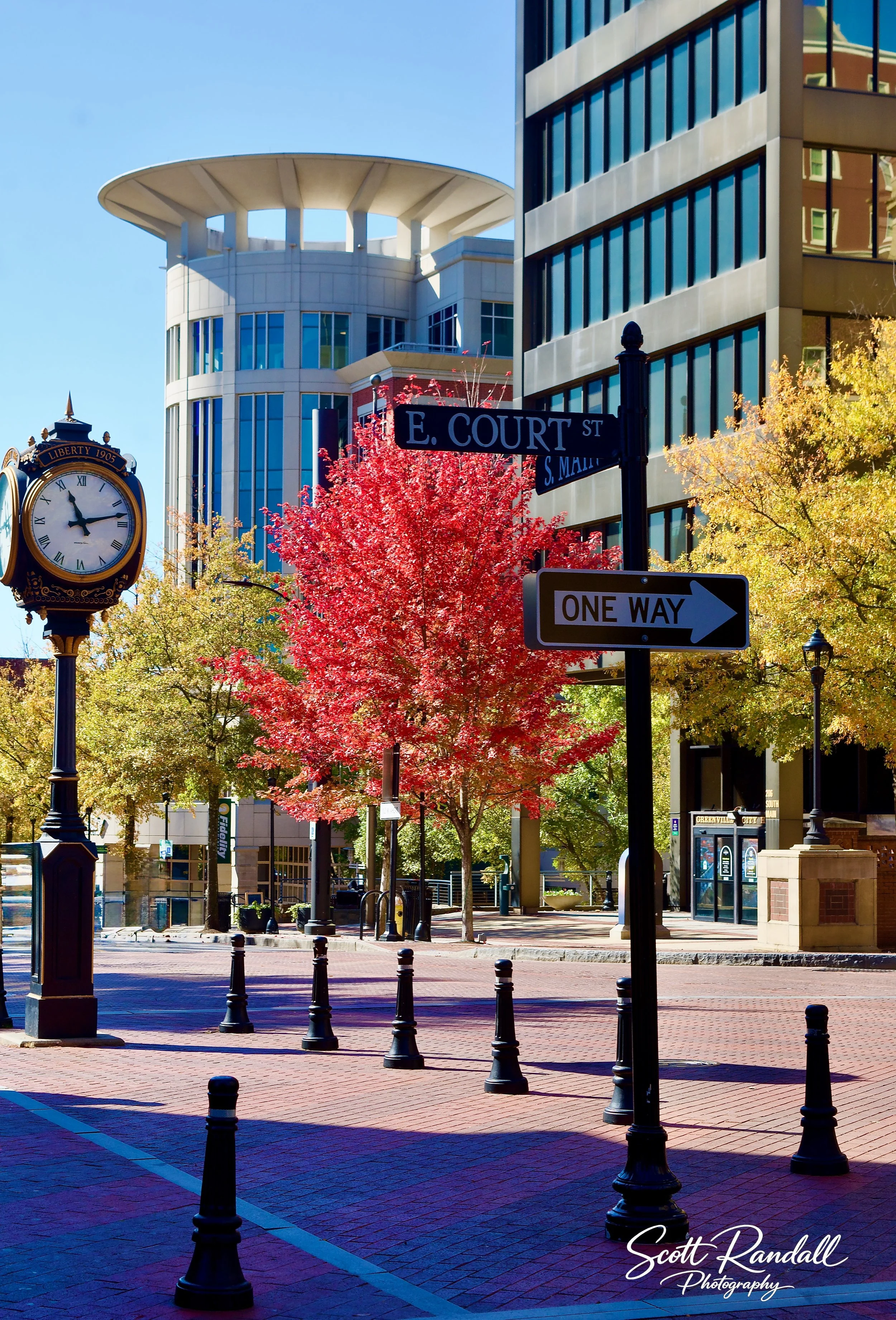 "Fall Times". Taken downtown Greenville, SC.  Loved this view of the buildings as well as the East Court Street sign with the Liberty Clock in the background.  