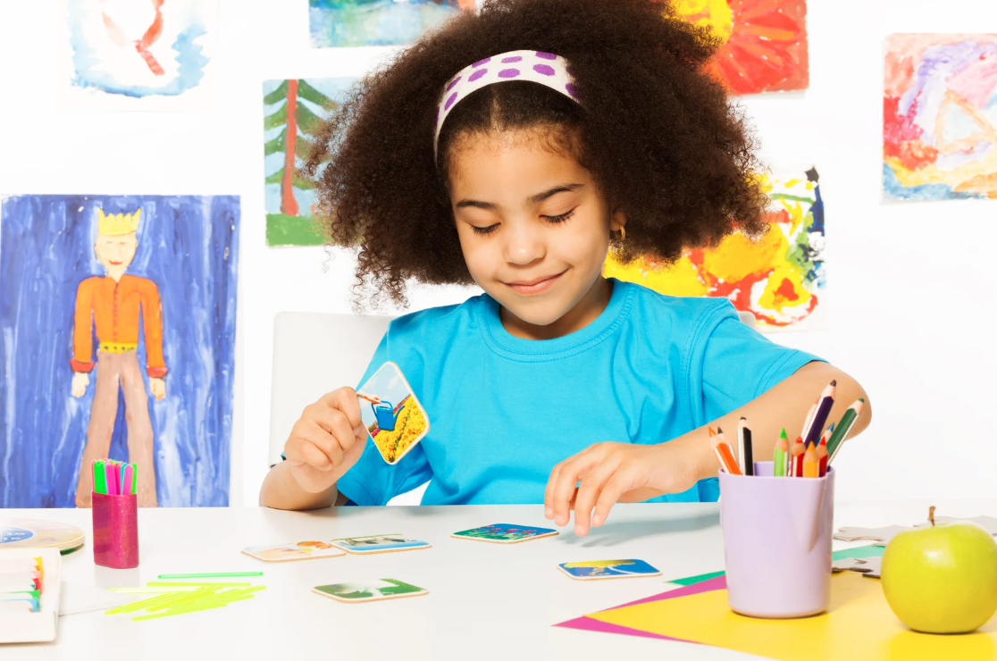 This is a picture of a girl color matching while doing arts and crafts