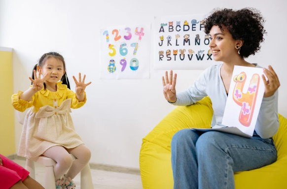 This is a photo of a teacher and student counting