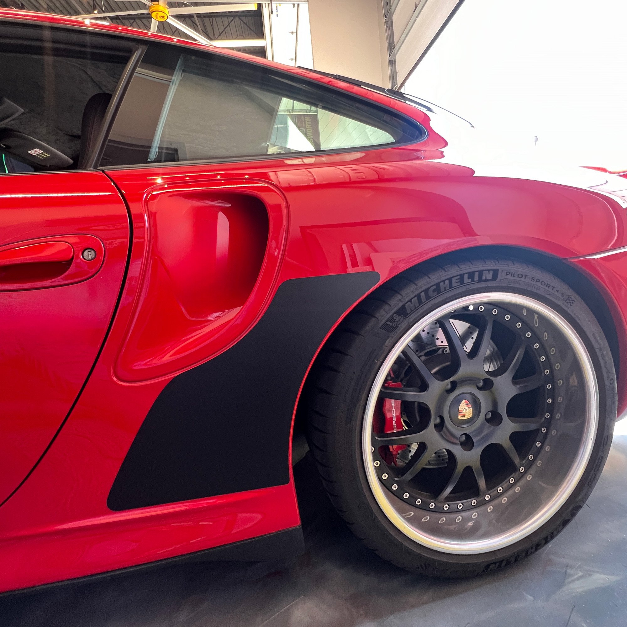 Red 996TT-with-black-MagnaFin-driver side.jpg