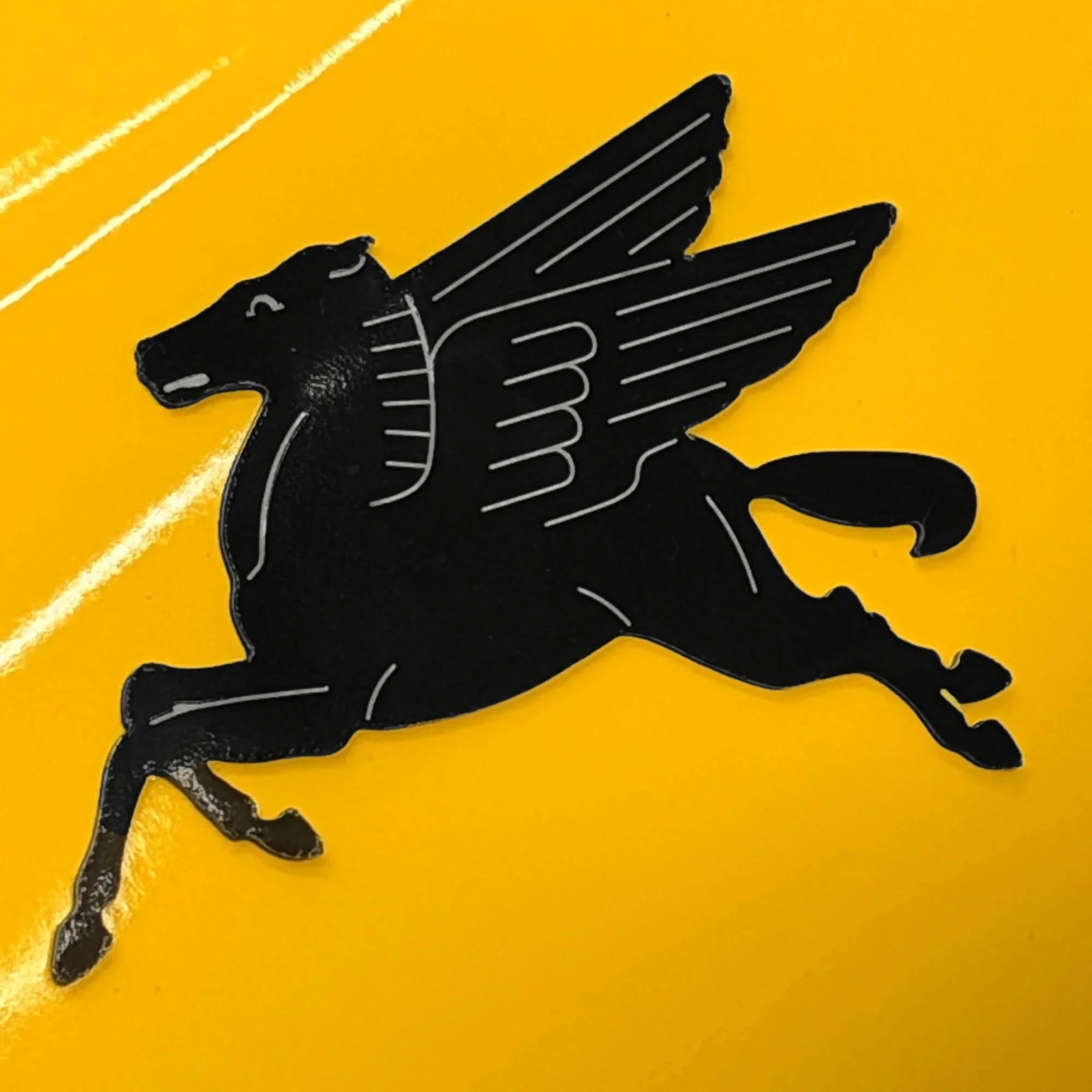 Black-pegasus-magnet-on-yellow-porsche.jpg