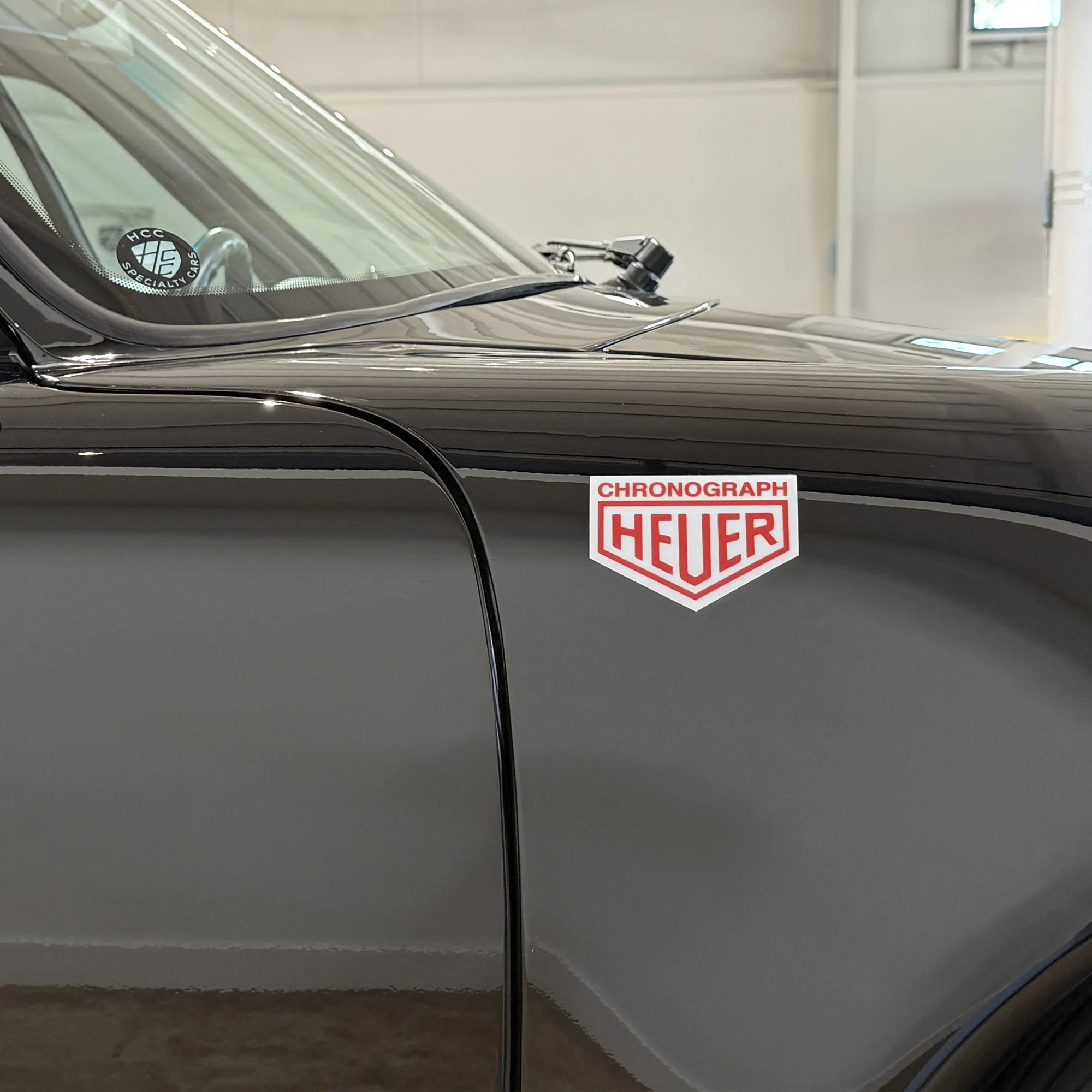 Red-Heuer-magnet-on-black Porsche-911-side hero.jpg