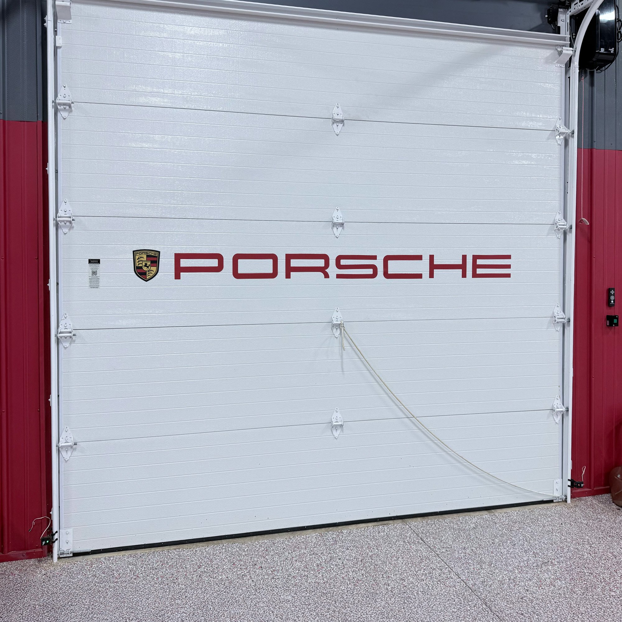 Garage_door_with_magnetic_Porsche_logo.jpg