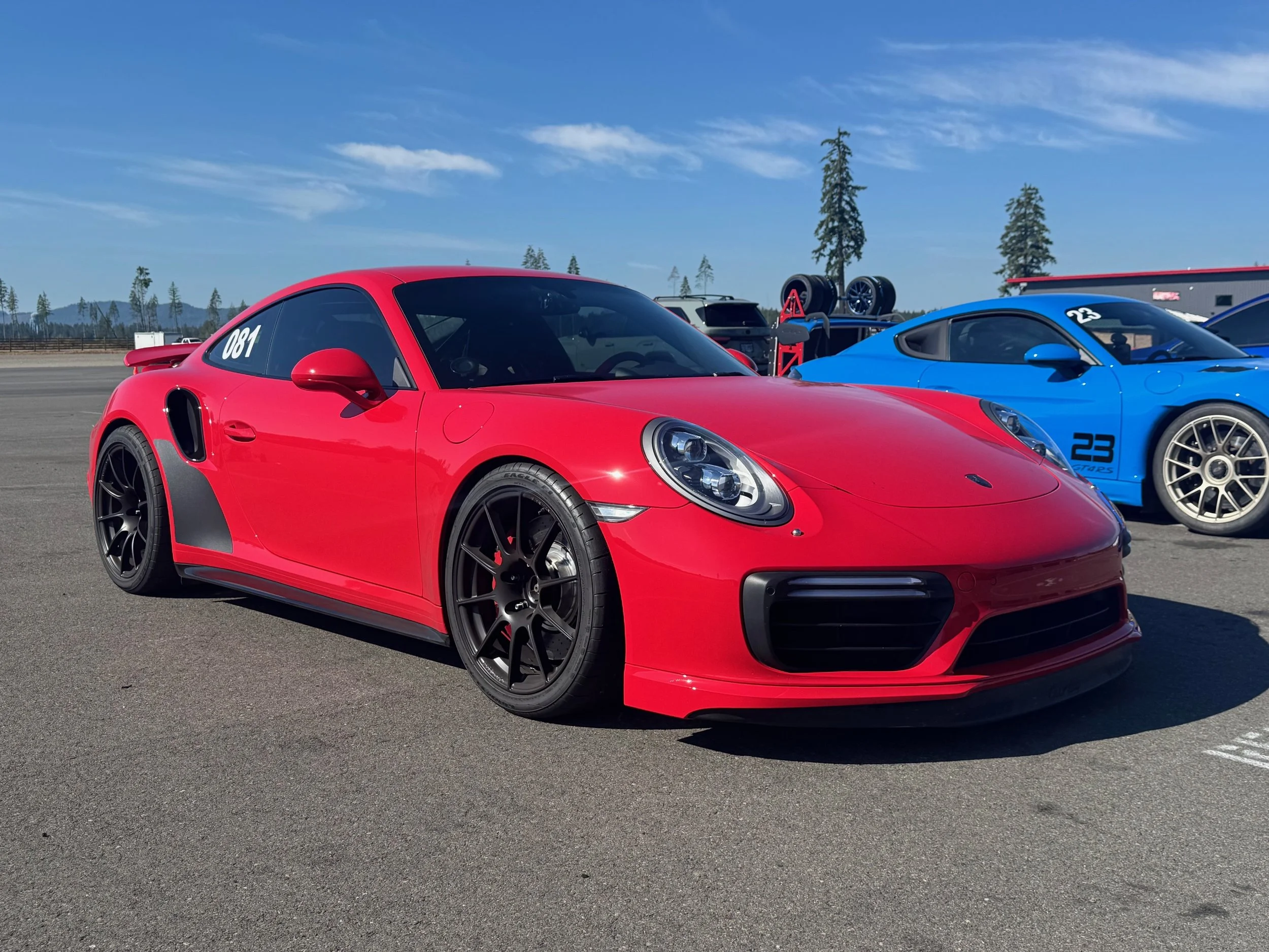 MagnaFin Deep Black magnetic stone guard on red Porsche 991 turbo protected for track day.
