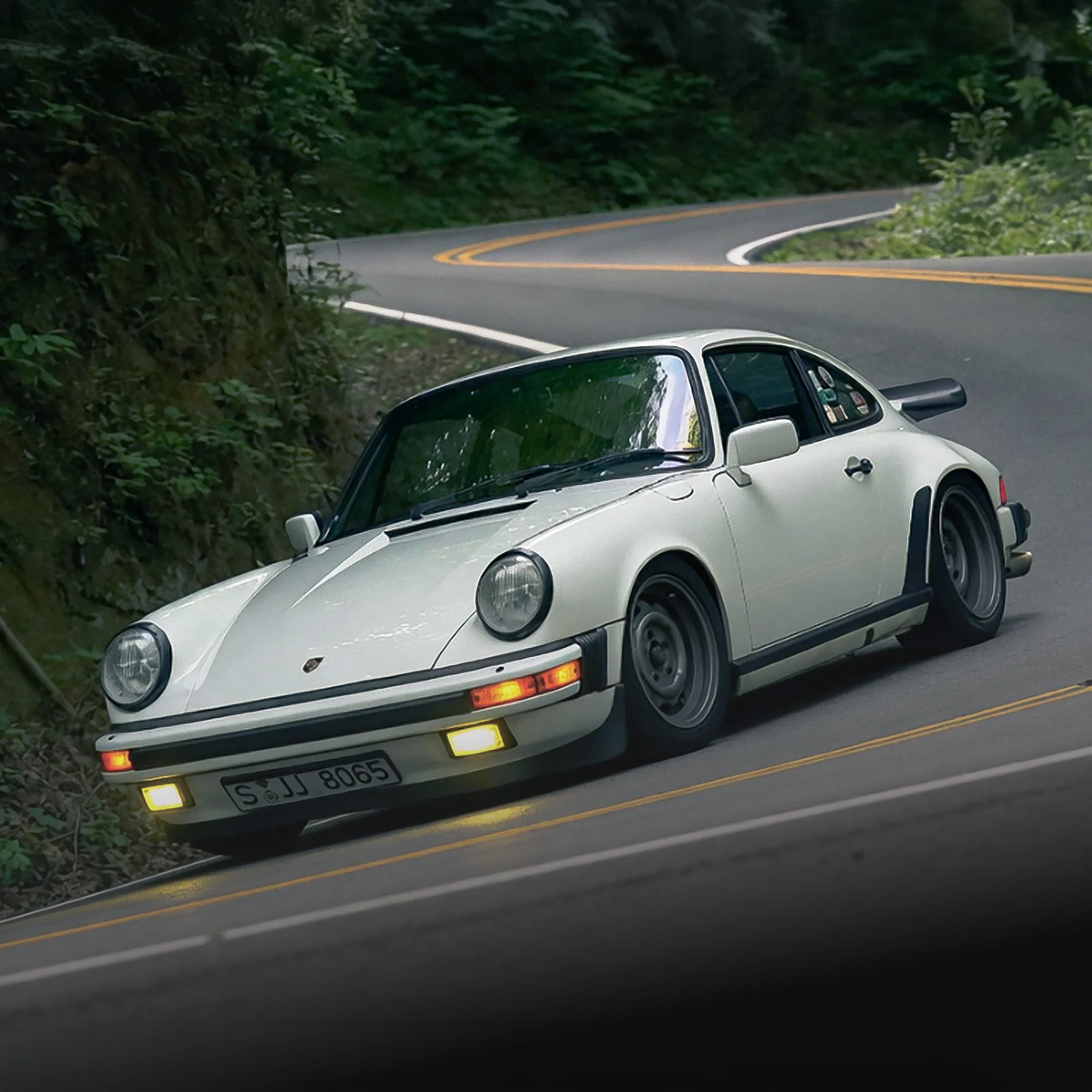 0000_White-911G-cornering-black magnetic-chip-guards.jpg