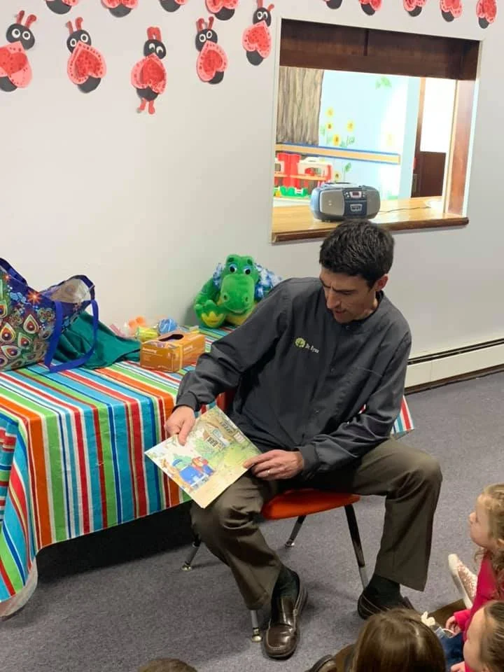 Dr. Ryan reading at Gold Hill Lutheran Church Preschool