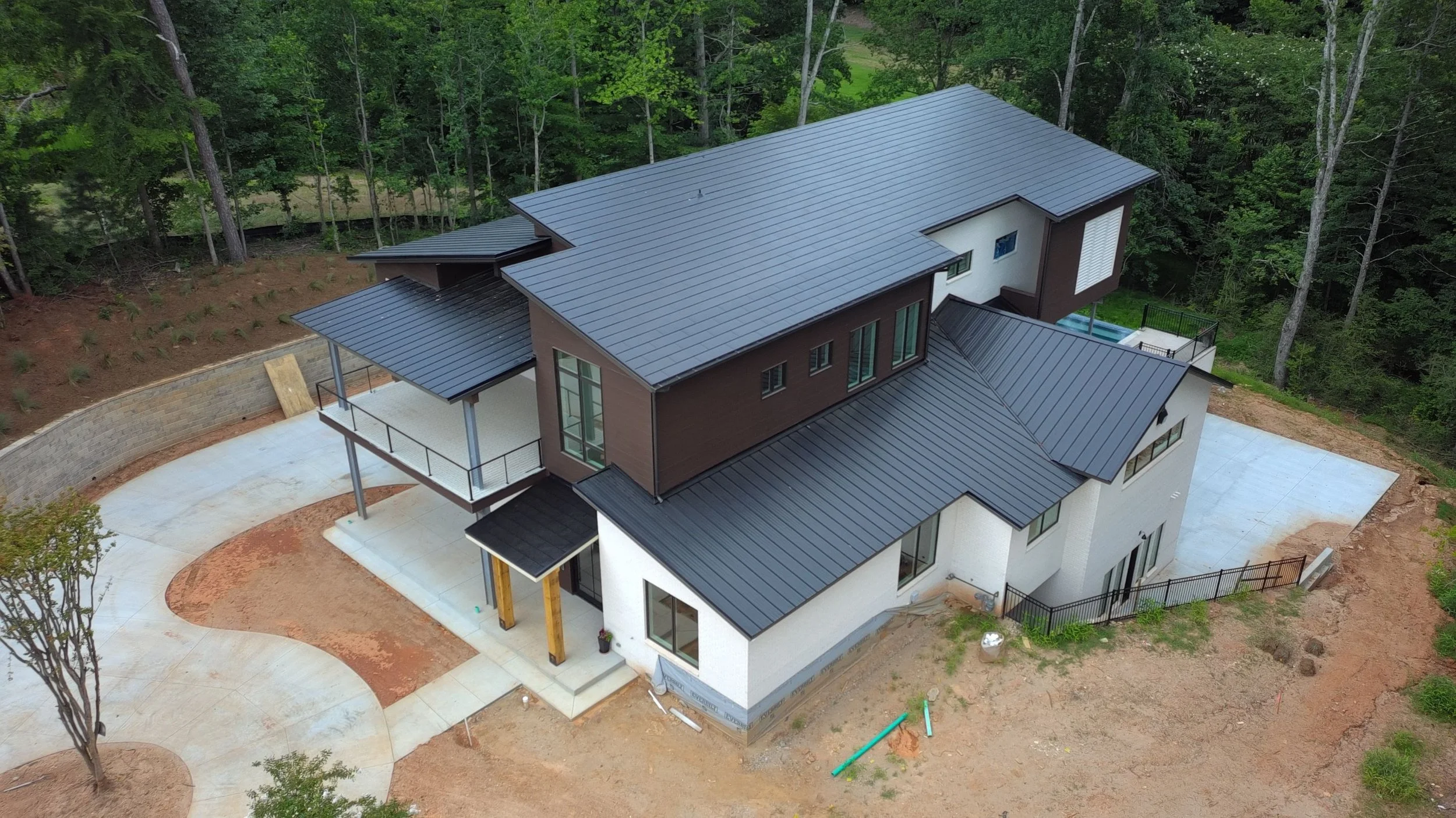Metal roof with Tesla Solar Roof on new build home in Georgia.