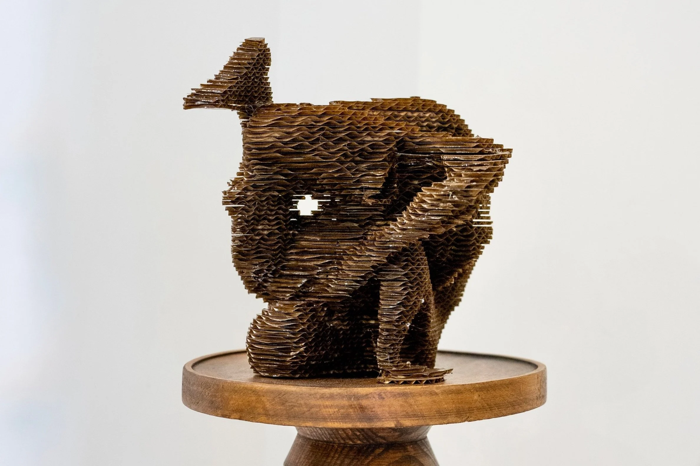 'Leg Lock' (2025), Cardboard & resin, 18(H)x20(W)x21(D)cm.