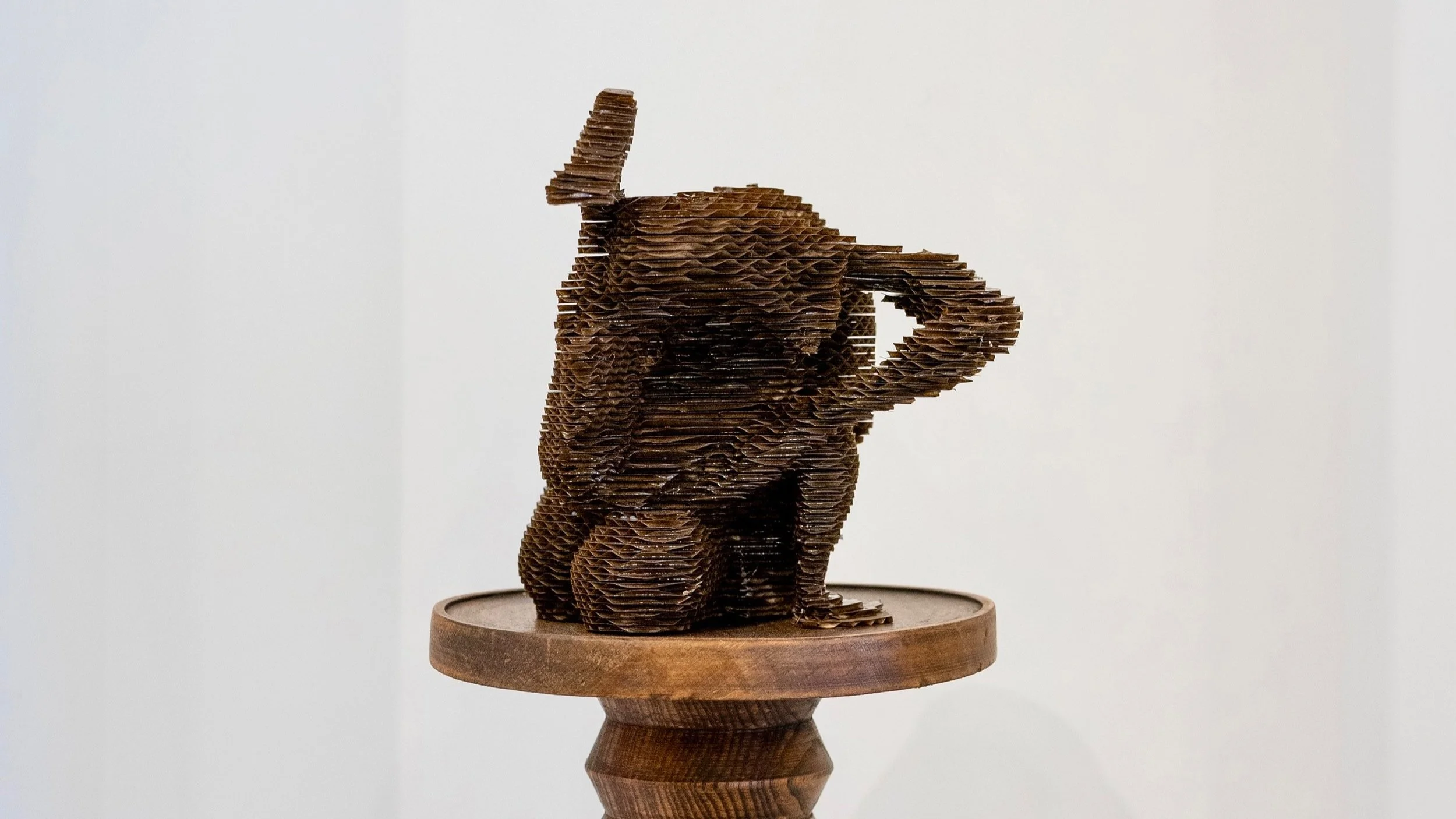 'Leg Lock' (2025), Cardboard & resin, 18(H)x20(W)x21(D)cm.