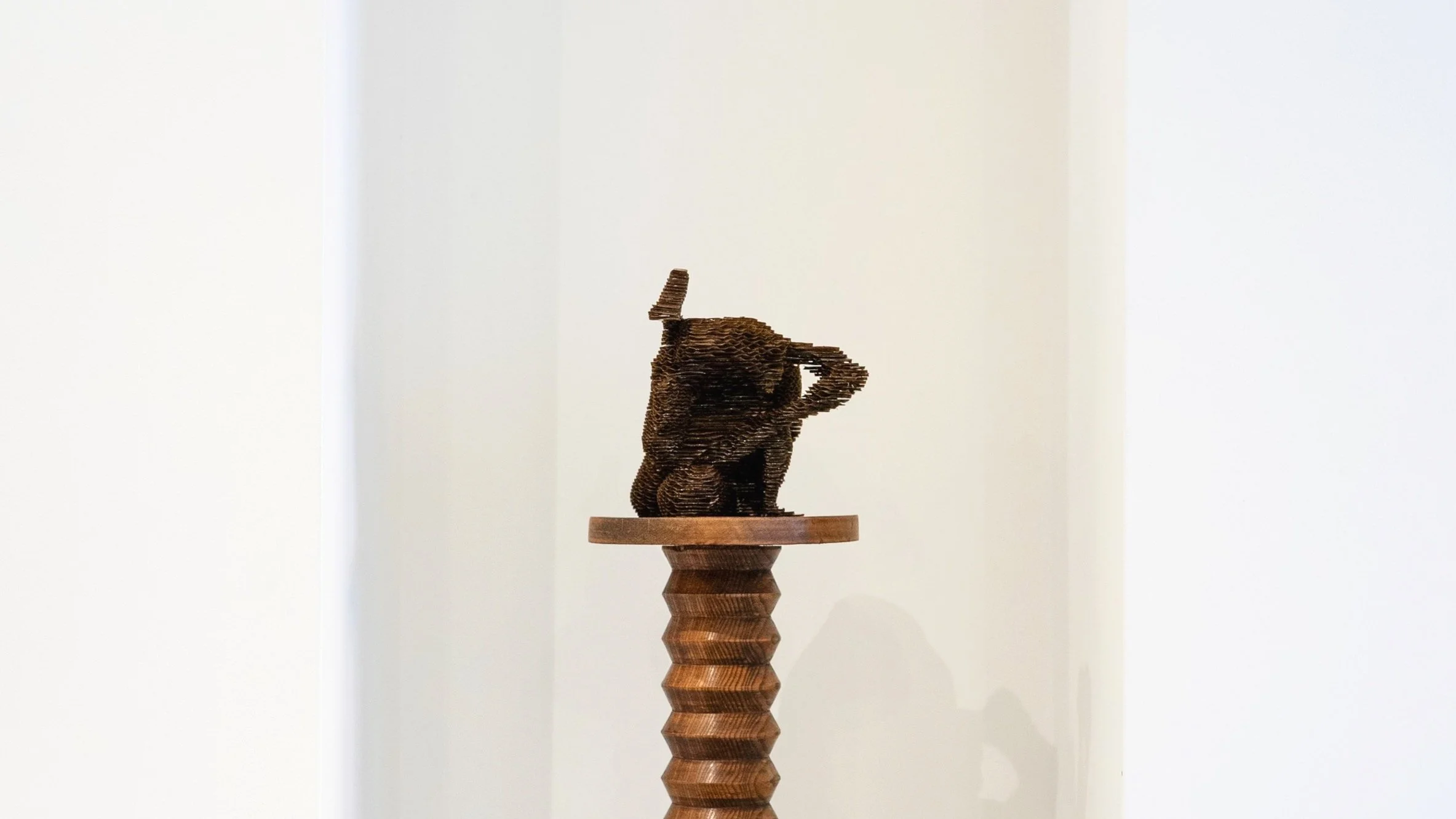 'Leg Lock' (2025), Cardboard & resin, 18(H)x20(W)x21(D)cm.