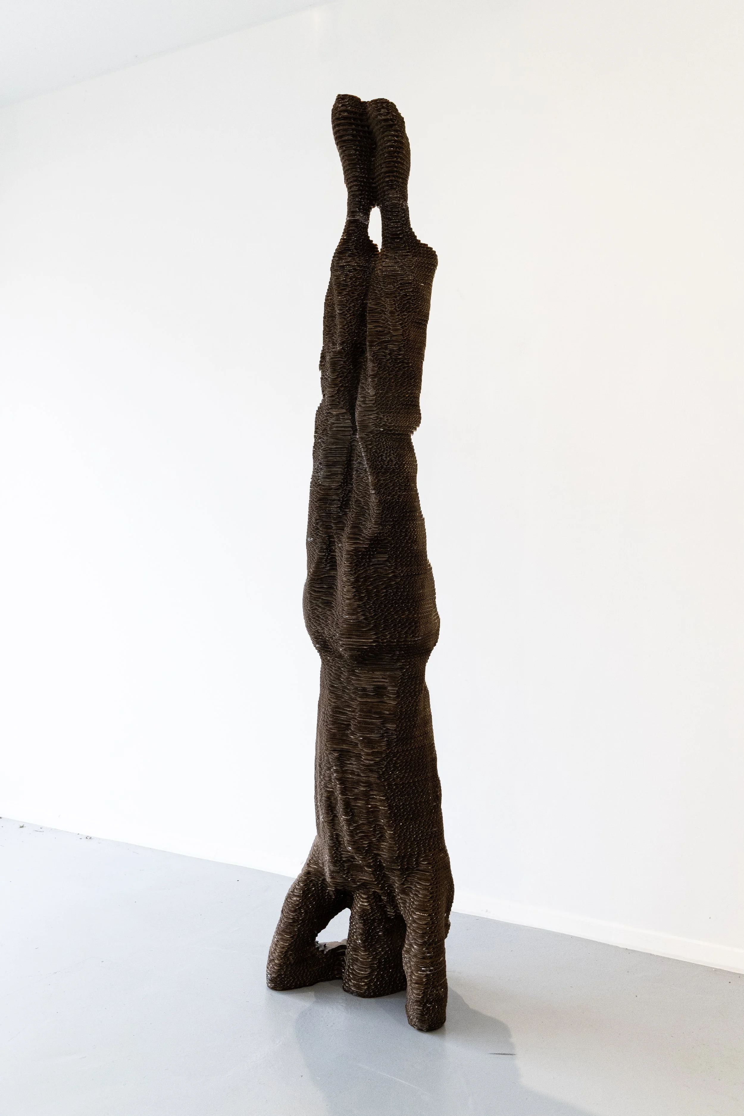 'Headstand' (2023, Cardboard & resin, 163(H)x38(W)x37(D)cm.