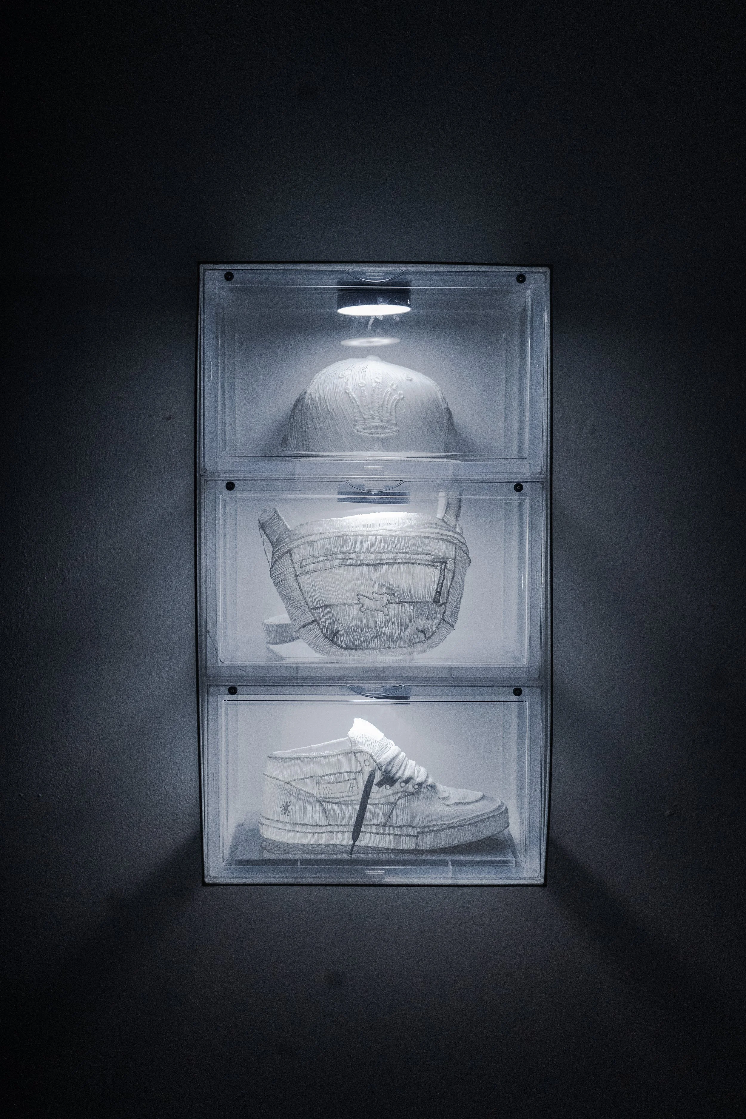 'FIFTY FIFTY GHOST' (2025), Powder coated steel, plastic display cases, hand drawn PLA, white laces, LED. 60(H)x36(W)x22(D)cm. Private collection.