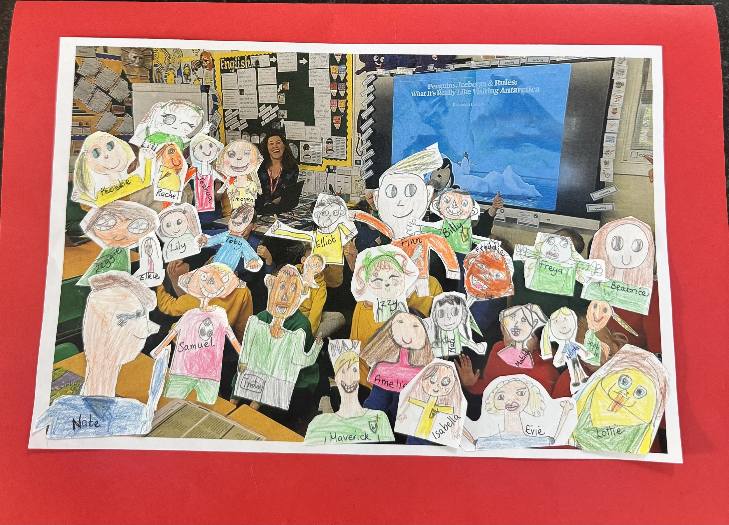 Colorful classroom display with hand-drawn character cutouts of children, each labeled with their names, surrounding a personality poster and a computer screen showing Antarctica.