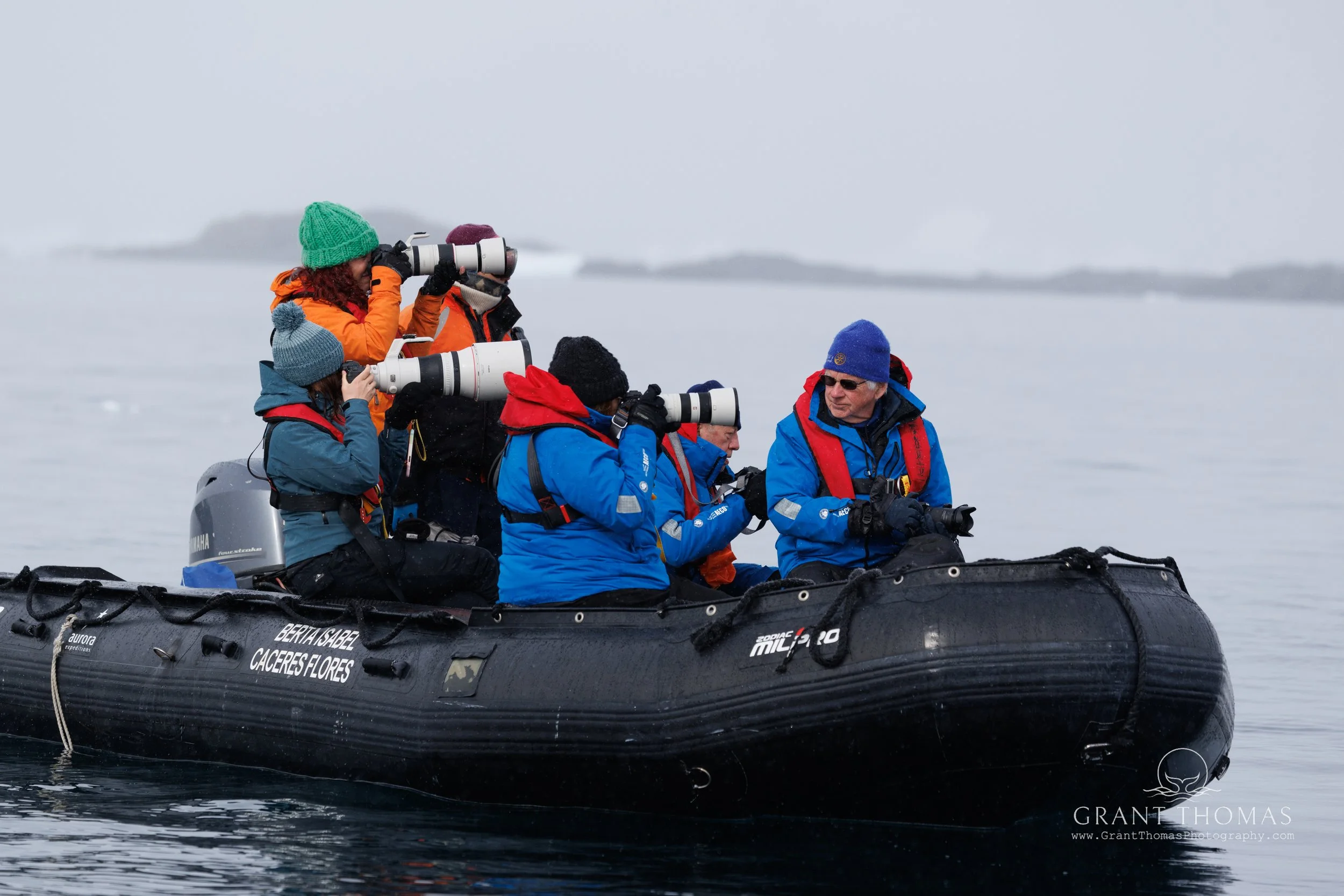 Rhiannon Lawler and fellow photographers on a zodiac, Antarctica