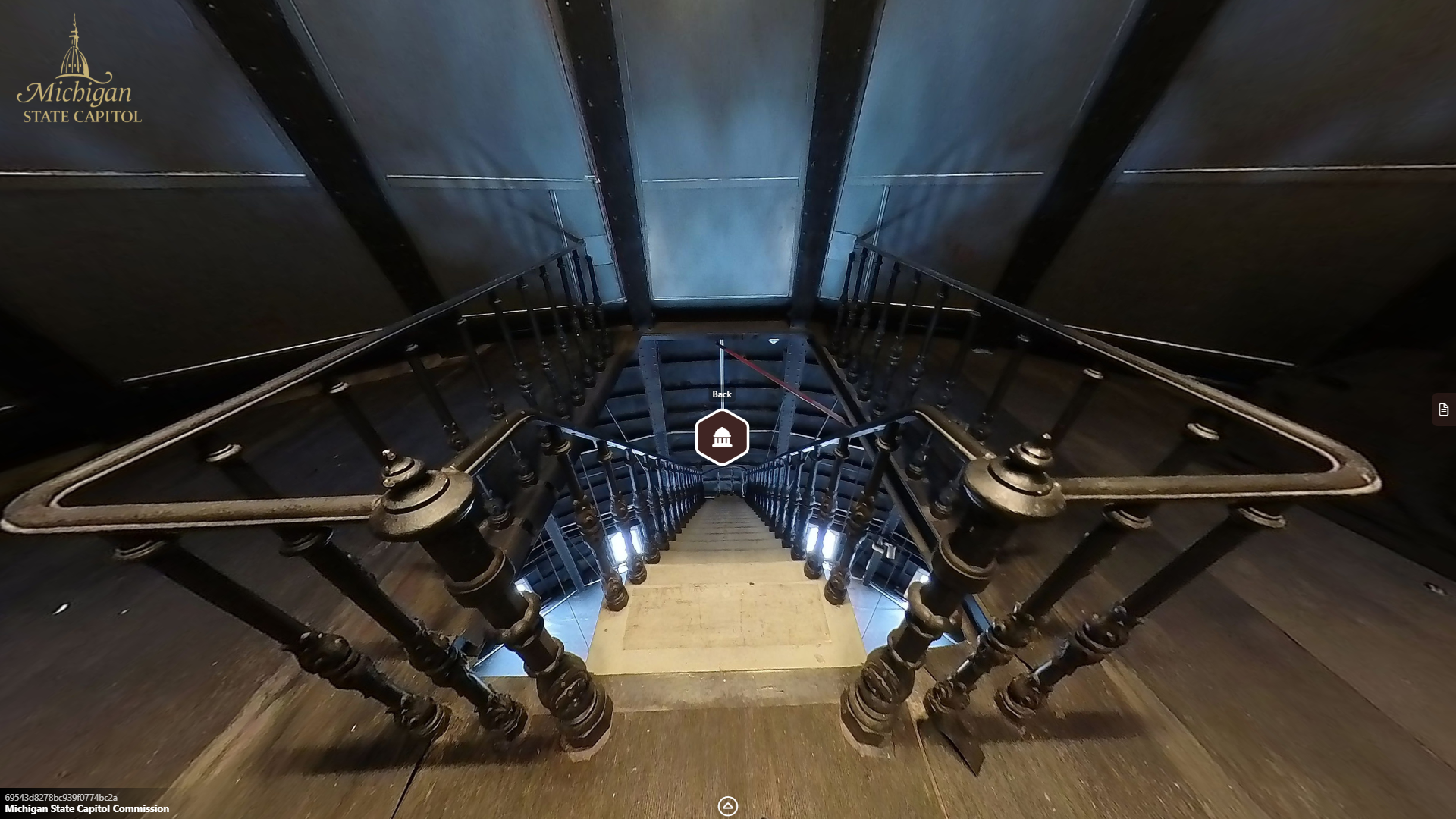 image of the top of a metal staircase looking downward.