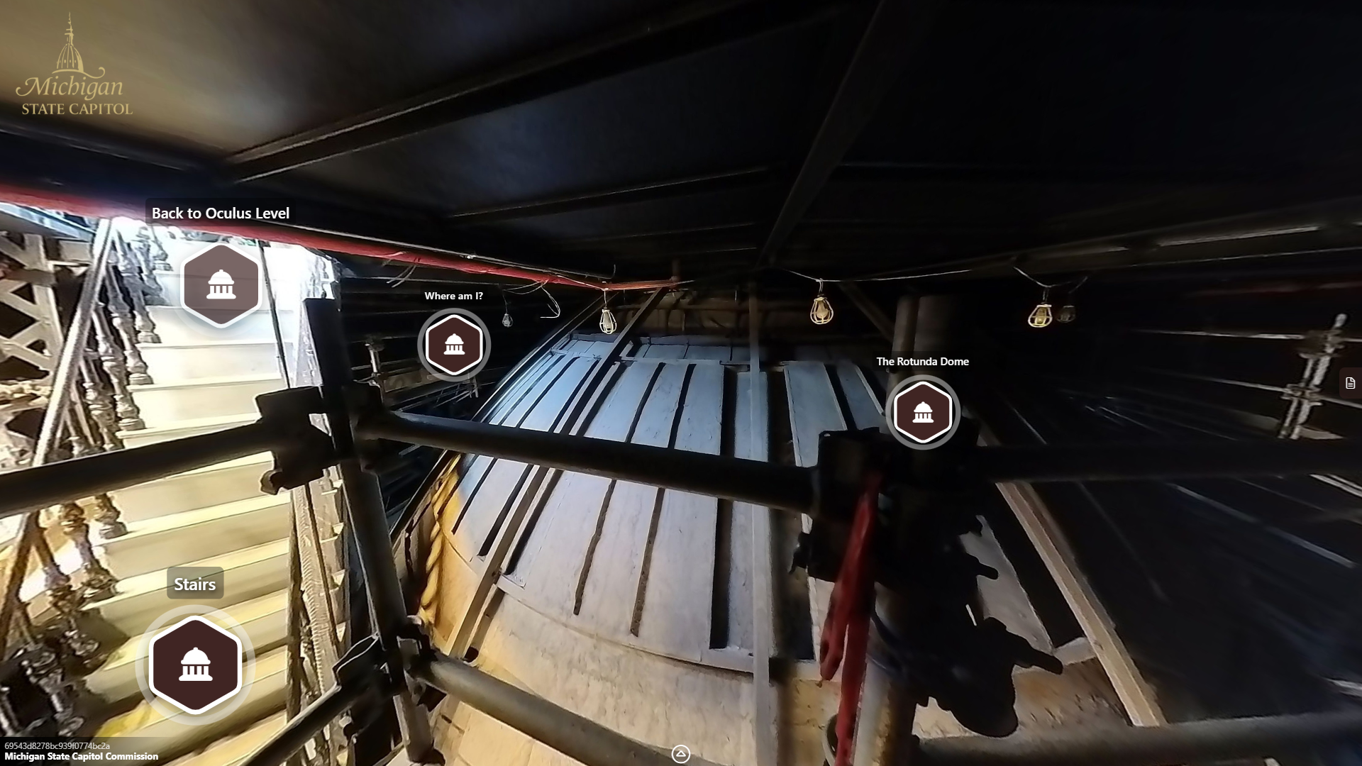 image of the backside of the rotunda dome, with a shallow ceiling above and narrow stairway leading downwards next to the rotunda dome.