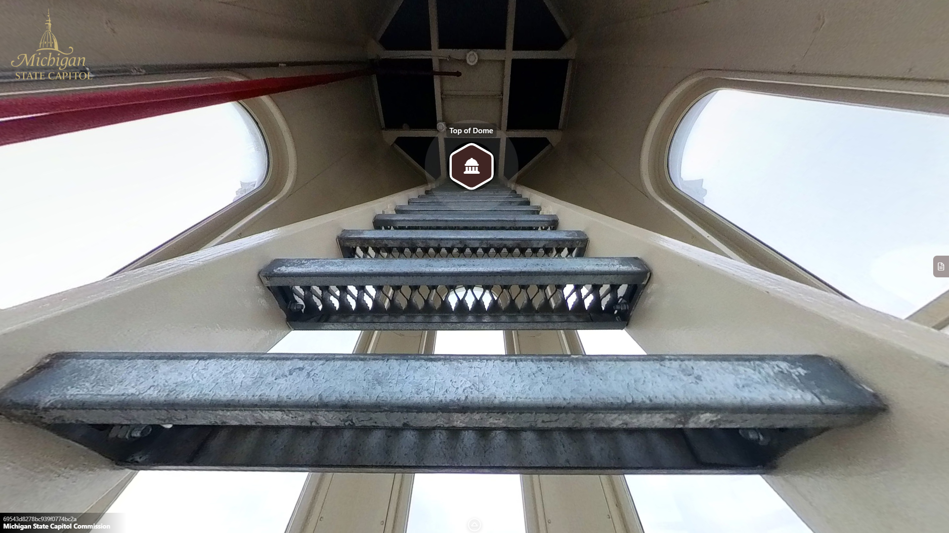 view of metal steps of a ladder or stair leading upward toward a metal platform, surrounded by tall windows.