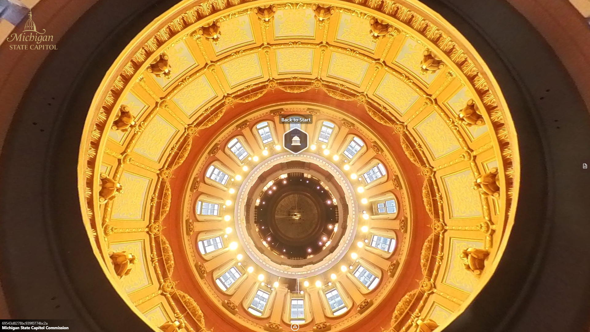 image of the rotunda from the top, showing several levels of balconies, windows, and lights extending down toward a glass floor.