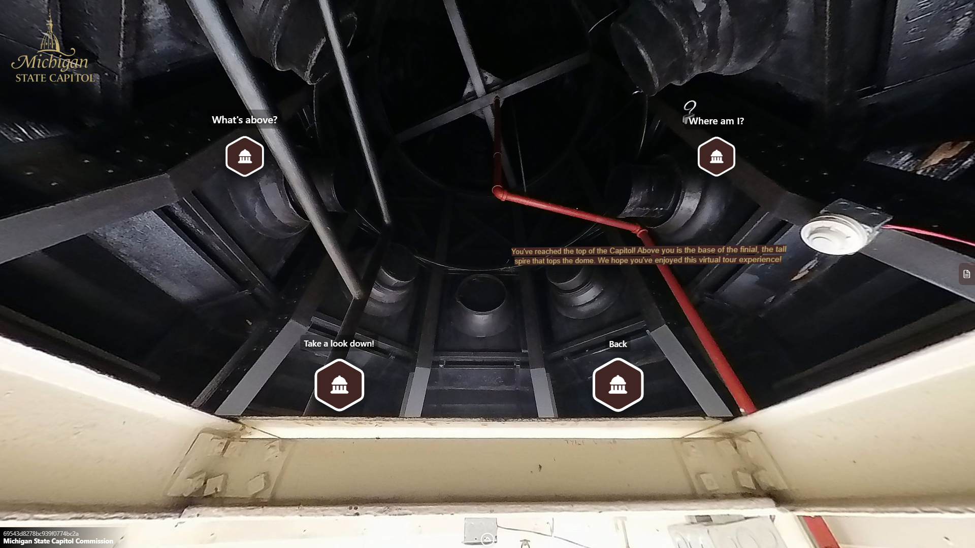 image of a small circular metal space with pipes and small column structures.
