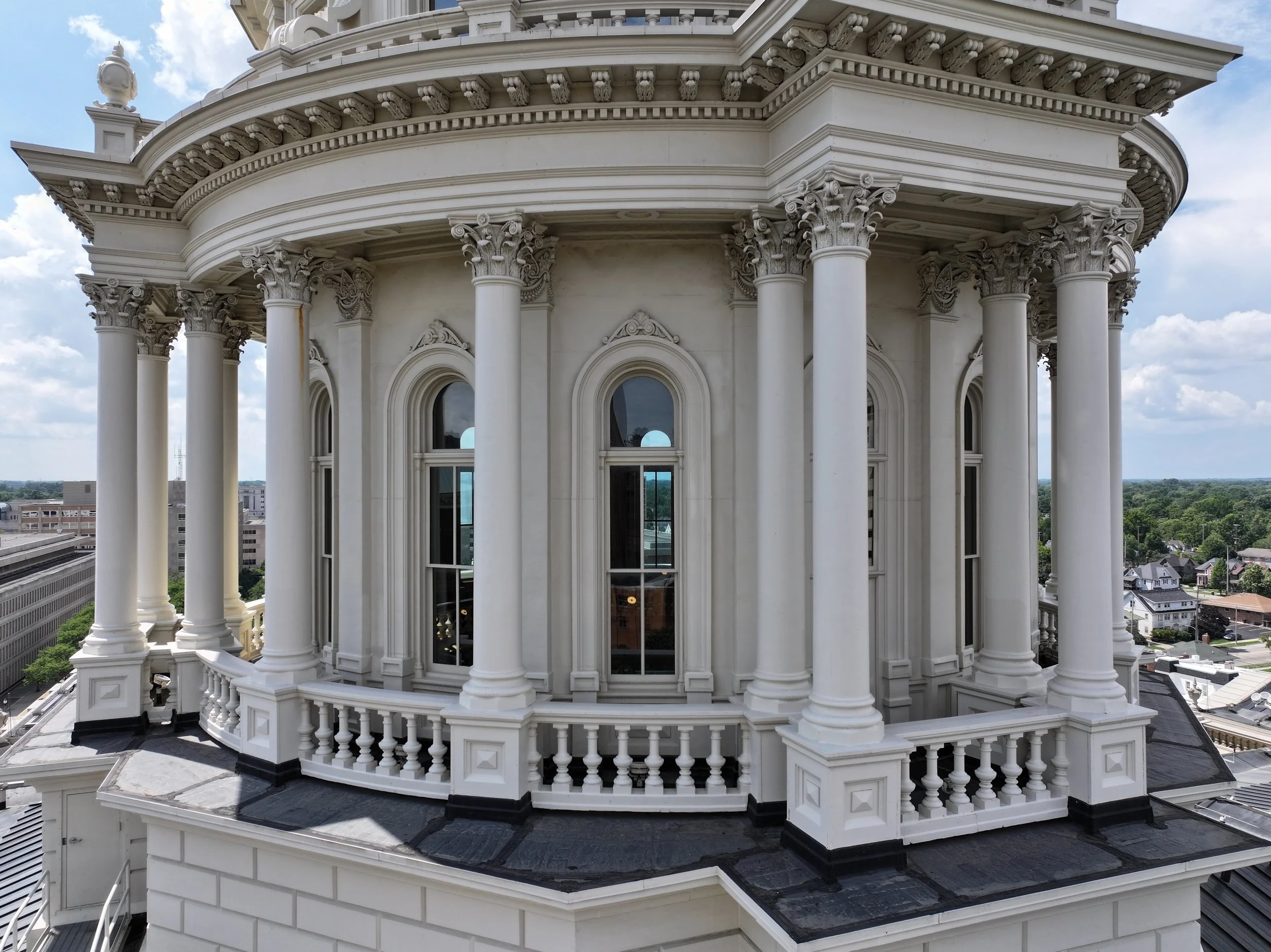 View of the dome from a drone outside showing columns and arched windows