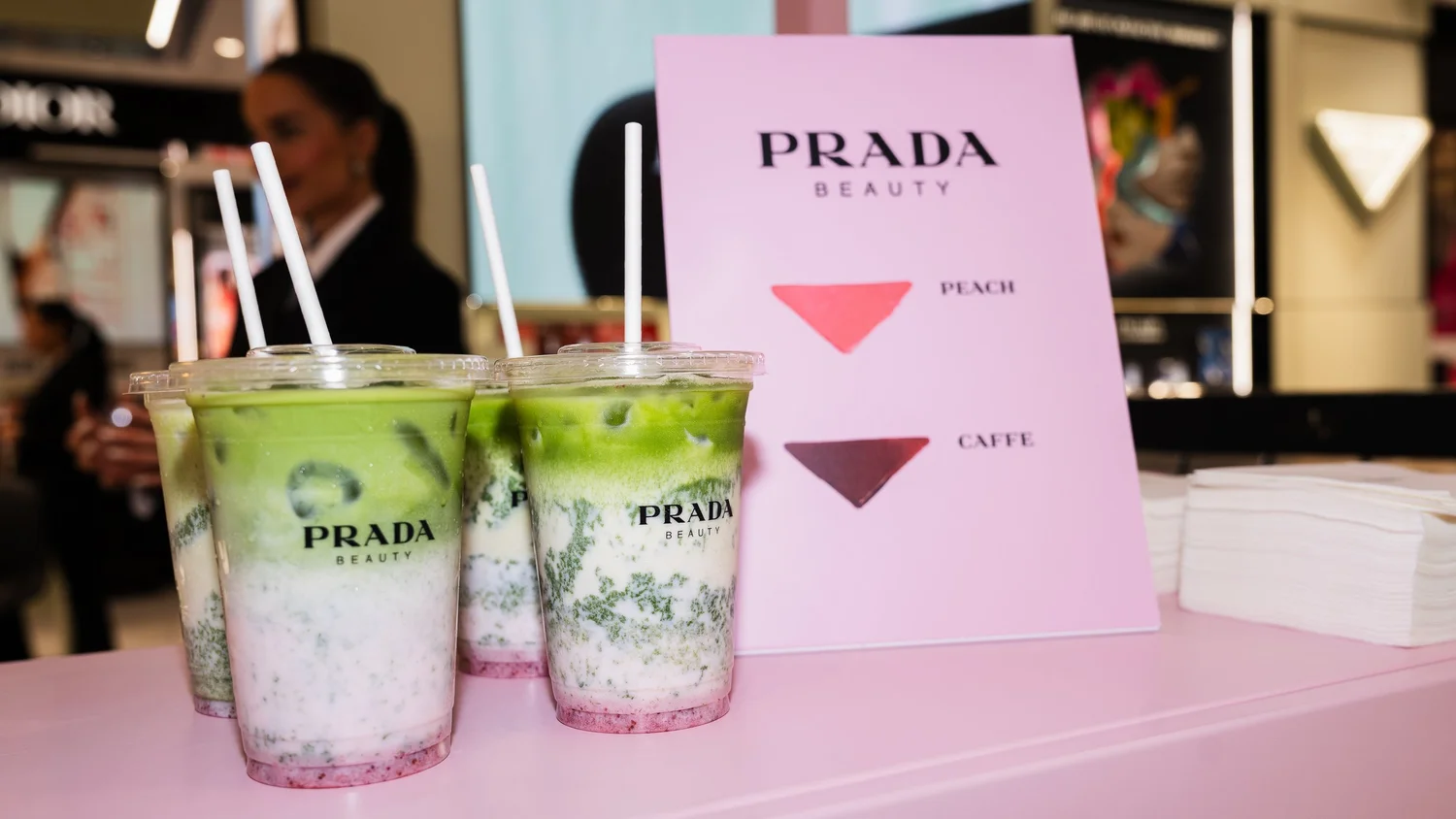 Prada Beauty matcha drinks on the pink Prada Touch kiosk