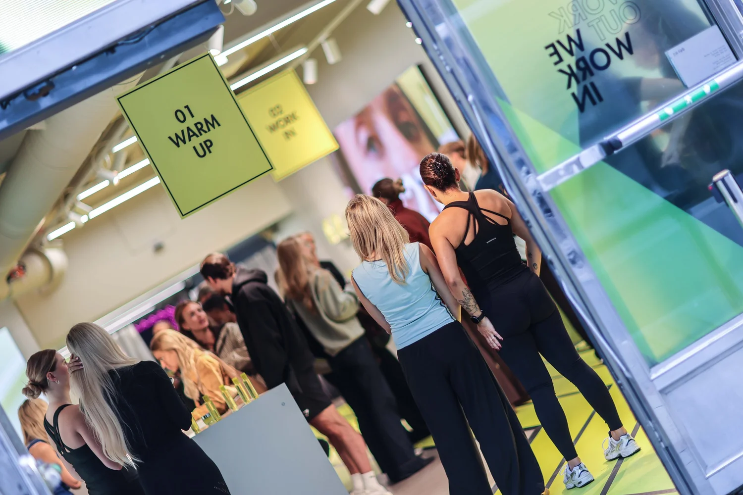 Participants lining up at the “01 Warm up” station