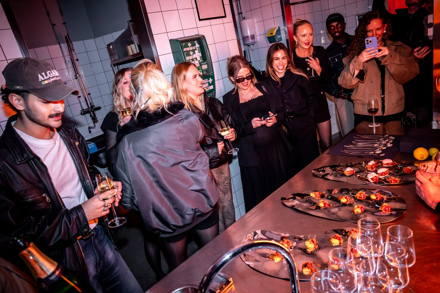 Guests gathering around the bar at co:lab