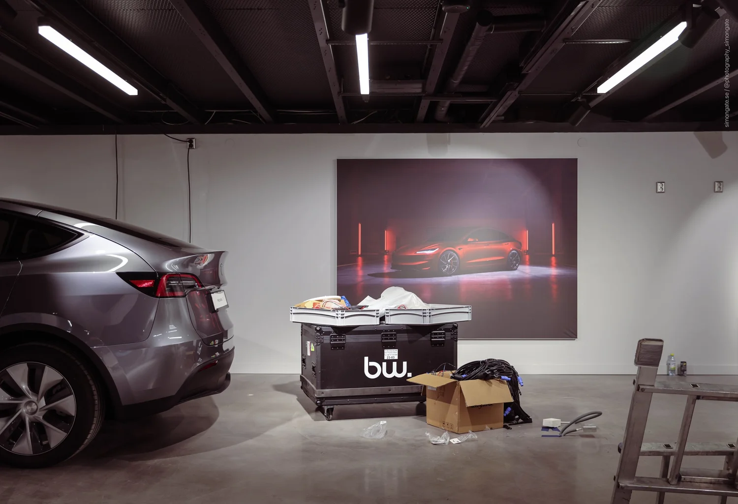 Tesla Model Y and Brandworks build crates during the store installation