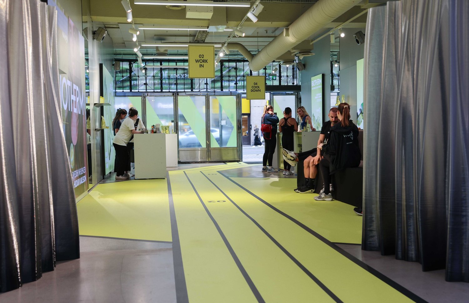 co:lab corridor with lime-green floor graphics leading to the training rooms