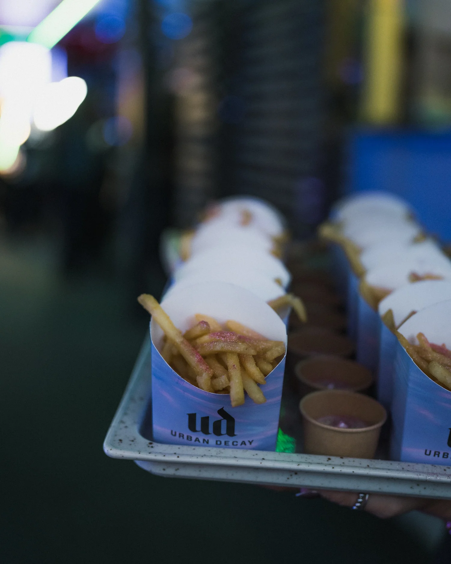 Urban Decay branded fries served on a tray at the release party